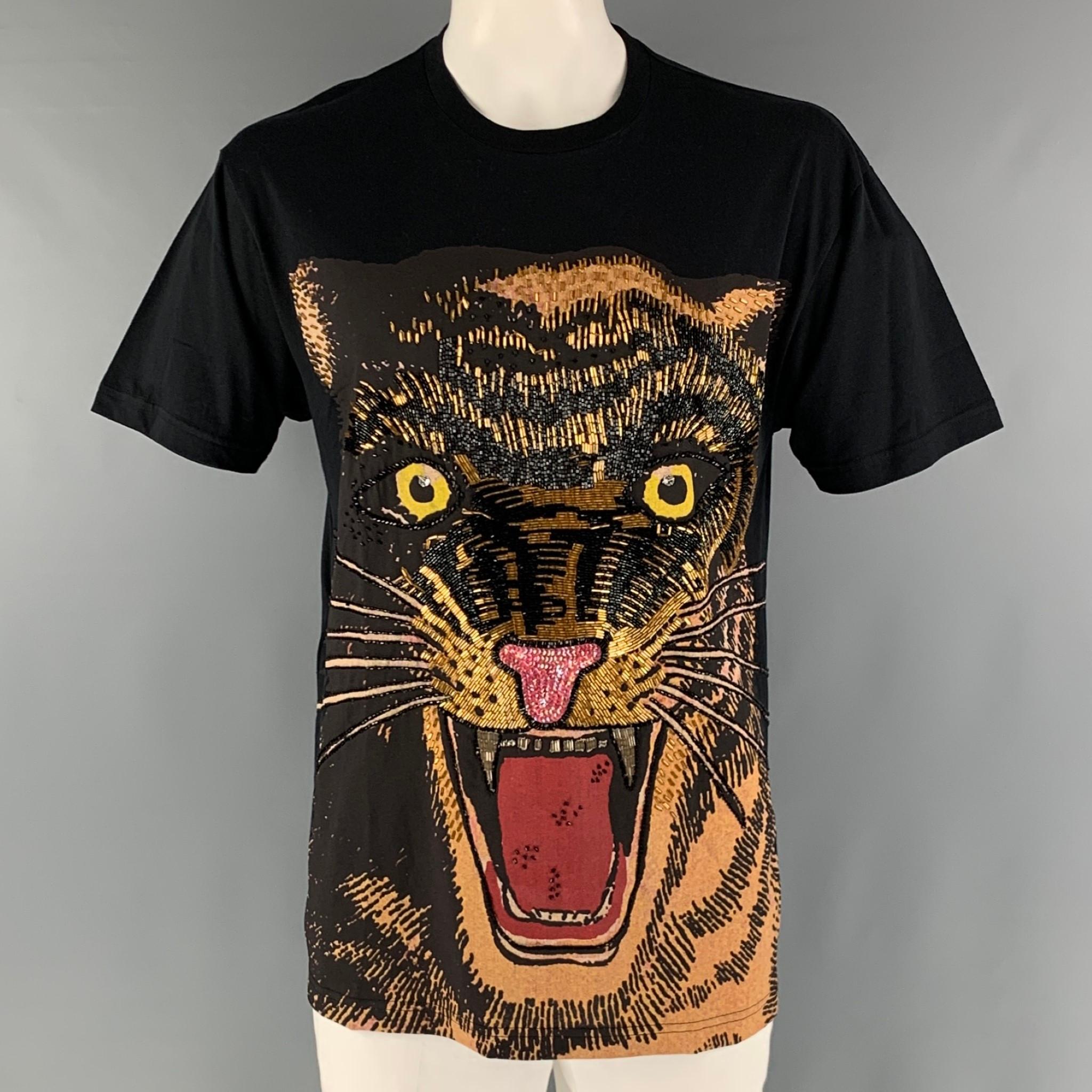 GUCCI F/W 2019 oversized t-shirt comes in a black jersey cotton knit material featuring a feline print with bead and sequin embroidery design at front and a crew-neck. Made in Italy.

New with Tags.
Marked: S

Measurements:

Shoulder: 22 in.
Chest: