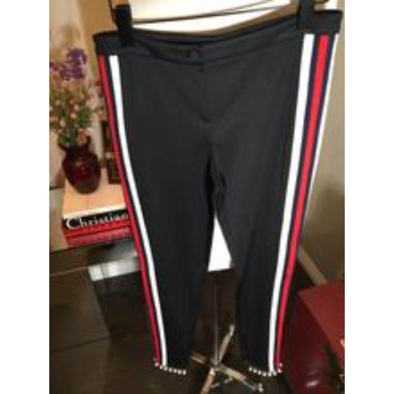 Gucci is hotter than ever and these athletic style pants with unique faux pearl and rhinestone over lace trim at the bottom are a real show stopper.
 
New and never worn with tags.  Original Retail: $1,350
Size S
Across the waist - 15 inches laying