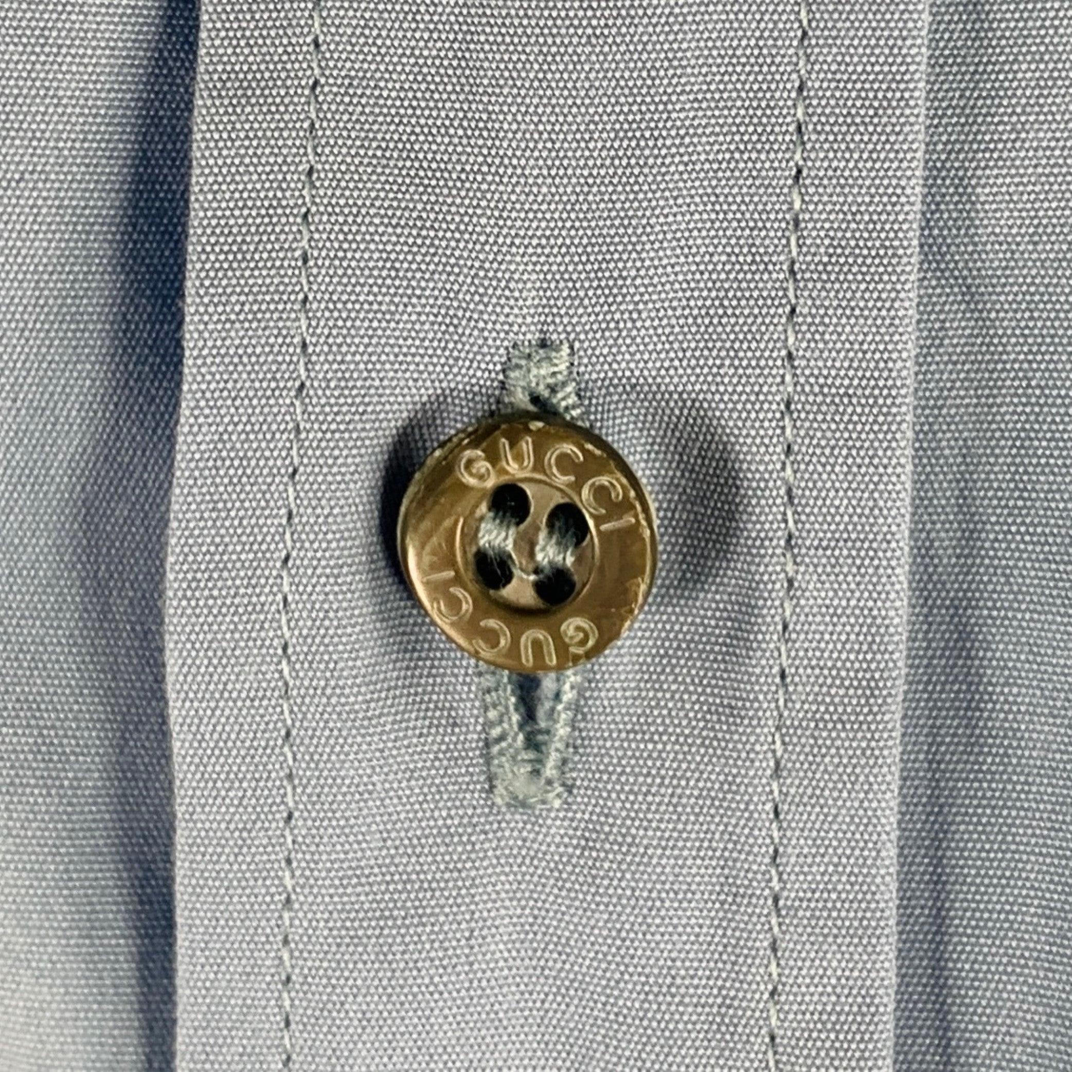 GUCCI
long sleeve shirt in a blue cotton woven fabric featuring a slim fit, spread collar, and button closure. Made in Italy.Very Good Pre-Owned Condition. Minor signs of wear. 

Marked:   39/15.5 

Measurements: 
 
Shoulder: 16 inches Chest: 41