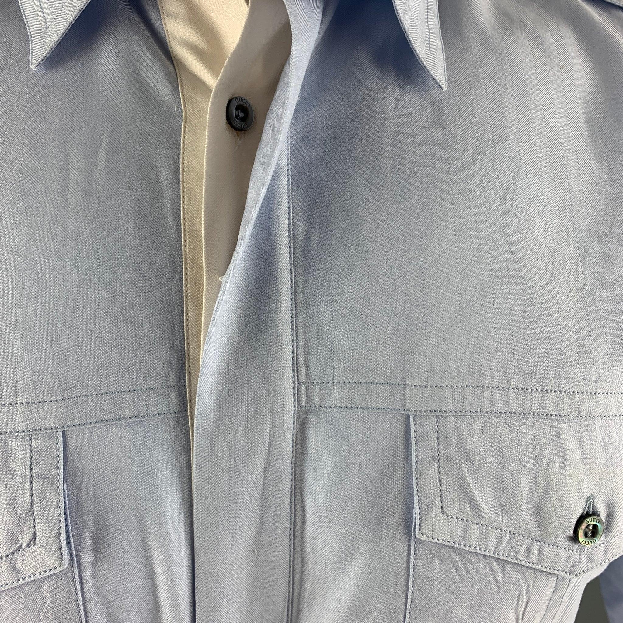 GUCCI long sleeve button down shirt comes in a light blue slim cut design with two front patch pockets and a concealed placket. 100% cotton. Made in Italy.
New with Tags. 

Marked:   S
 

Measurements: 
  
Shoulder: 17 inches Chest: 38 inches