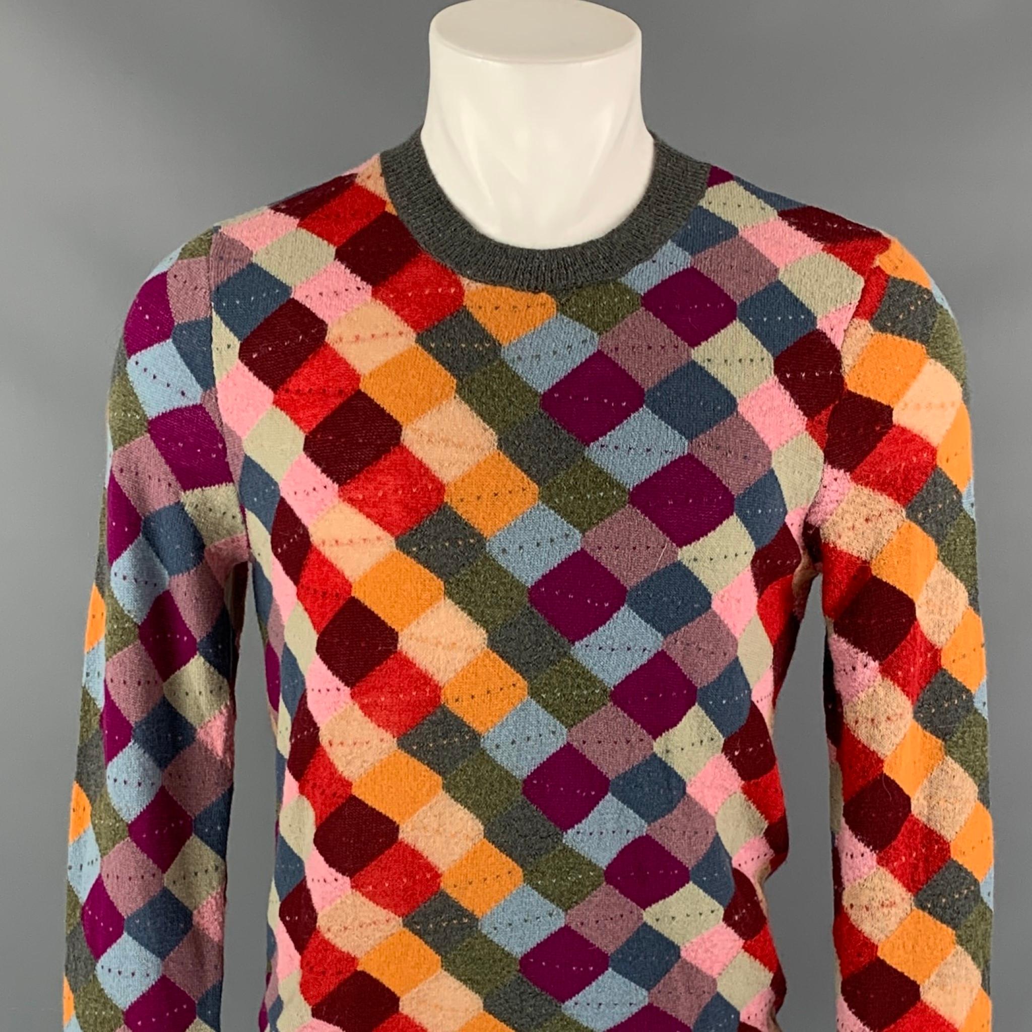 GUCCI pullover comes in a multi-color knitted square mohair blend featuring a ribbed hem and a crew-neck. Made in Italy 

Very Good Pre-Owned Condition.
Marked: S

Measurements:

Shoulder: 16.5 in.
Chest: 38 in.
Sleeve: 29.5 in.
Length: 25 in.