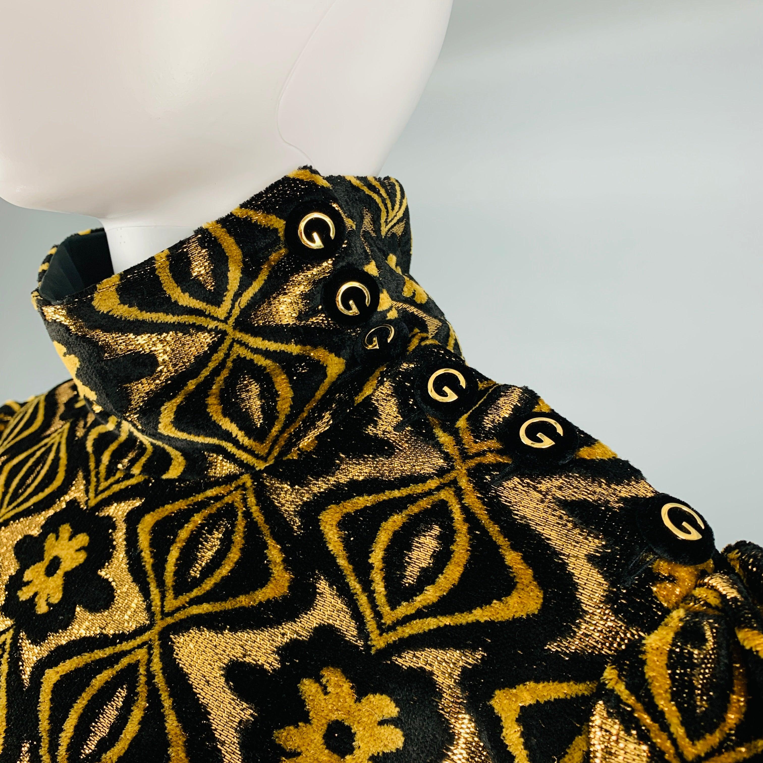 GUCCI cocktail dress comes in a black and gold viscose blend velvet features a high collar, half button closure with GG logo, long sleeve design, and long zip up closure. Made in Italy.Very Pre-Owned Condition. As-Is -2 Buttons replaced at cuffs