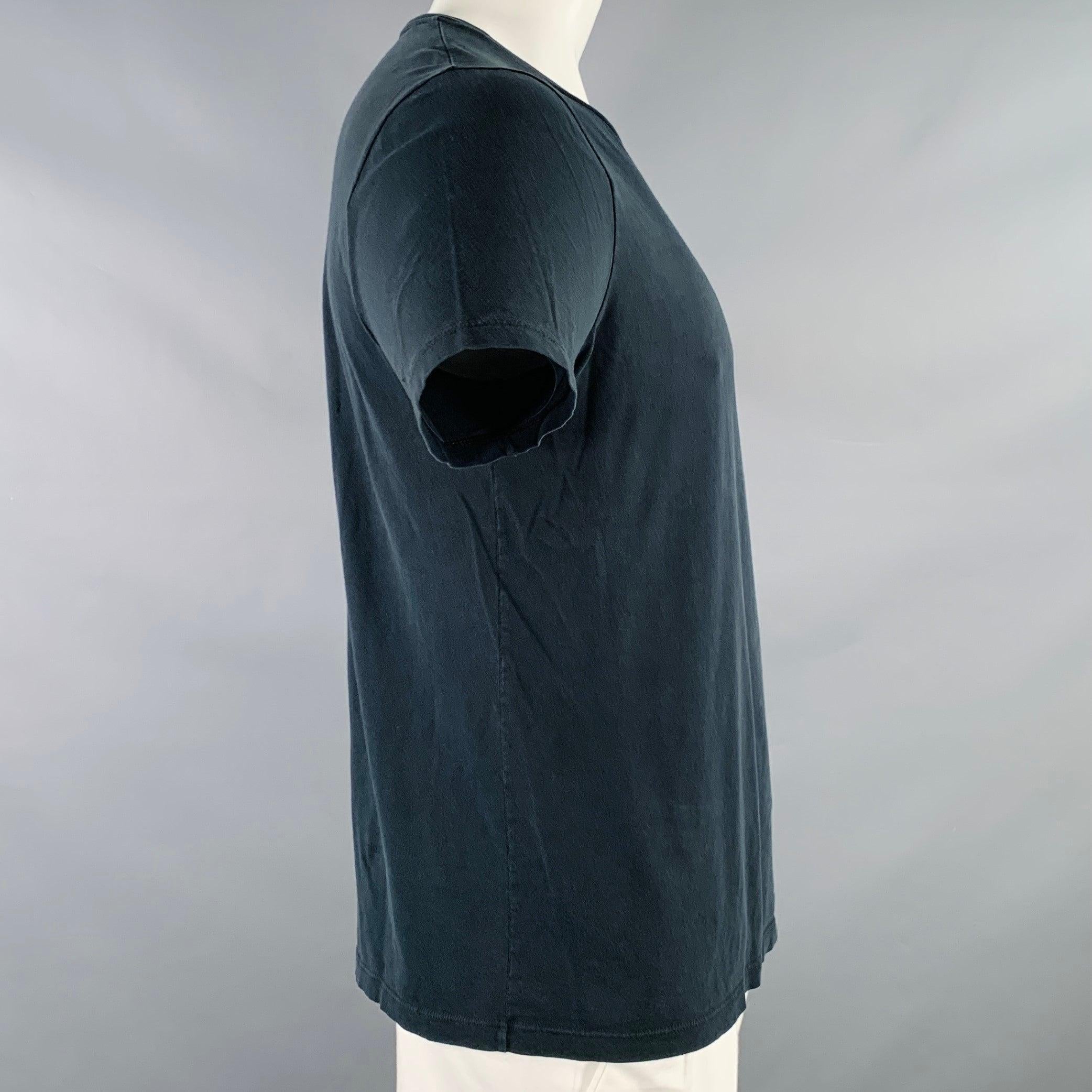 GUCCI t-shirt
in a black jersey featuring short sleeves and crew neck. Made in Italy.Good Pre-Owned Condition. Multiple minor holes, as is. 

Marked:   XL 

Measurements: 
 
Shoulder: 17.5 inches Chest: 42 inches Sleeve: 8 inches Length: 25.5 inches
