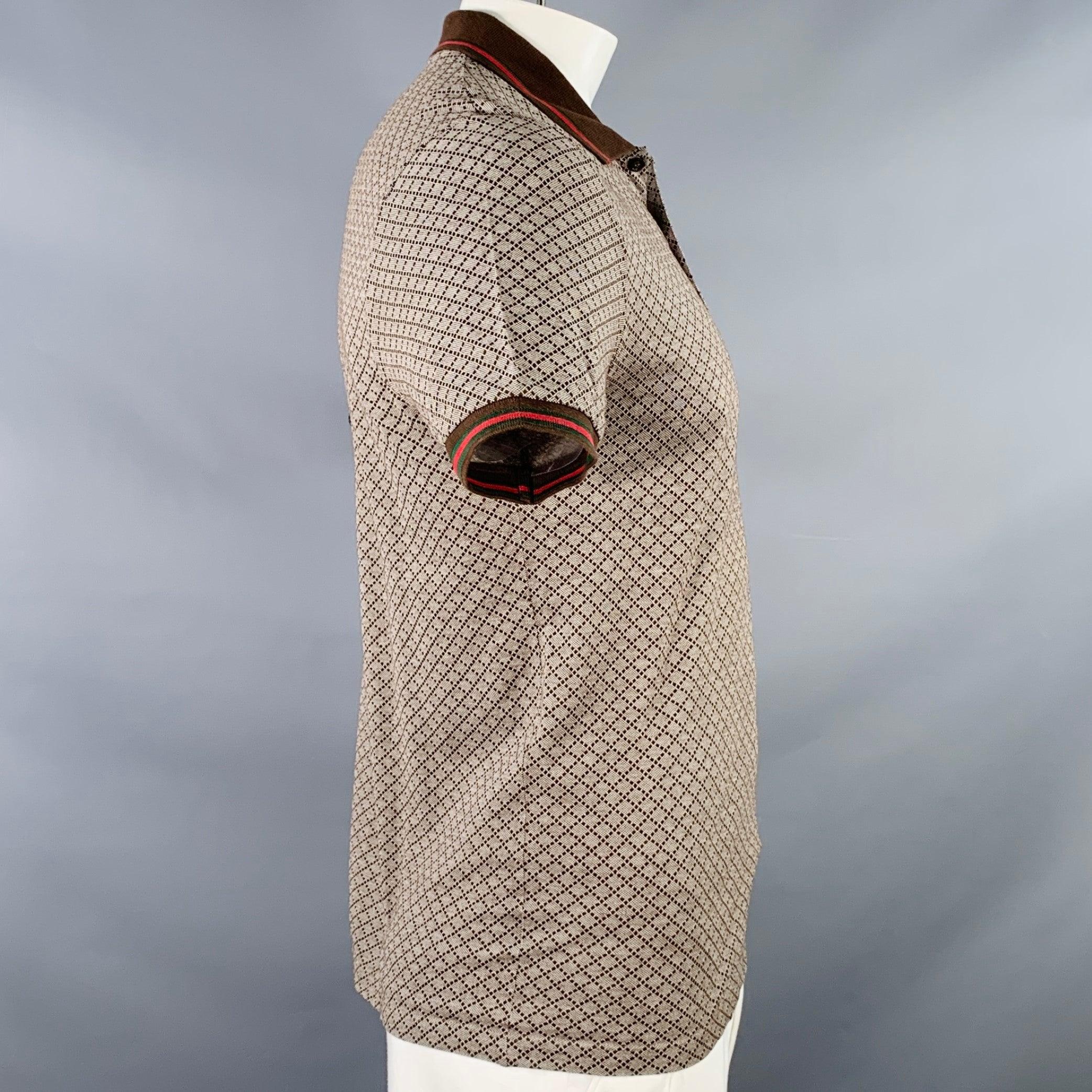 GUCCI polo
in a brown and red cotton featuring a diamond grid pattern, contrasting brown with red and green stripe trim, and half placket button closure. Made in Italy.Excellent Pre-Owned Condition. 

Marked:   XL 

Measurements: 
 
Shoulder: 18