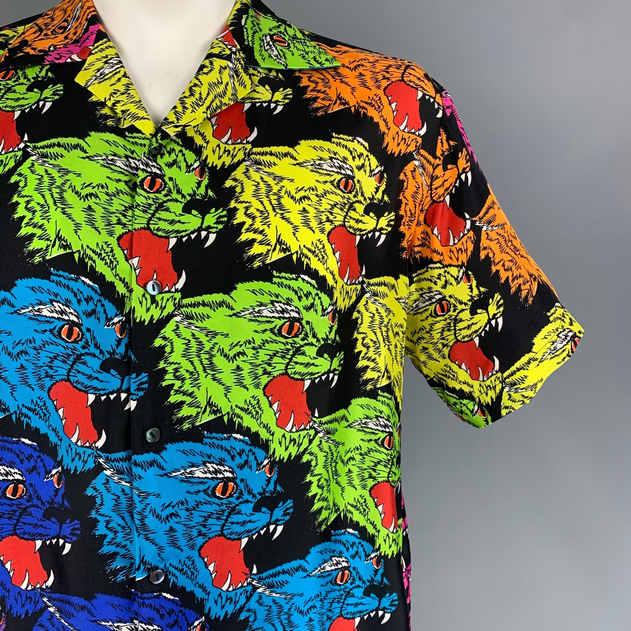 GUCCI short sleeve shirt comes in a multi-color 'angry tiger' print silk featuring a camp collar and a buttoned closure. Made in Italy.

Excellent Pre-Owned Condition.
Marked: 54

Measurements:

Shoulder: 21 in.
Chest: 48 in.
Sleeve: 11 in.
Length:
