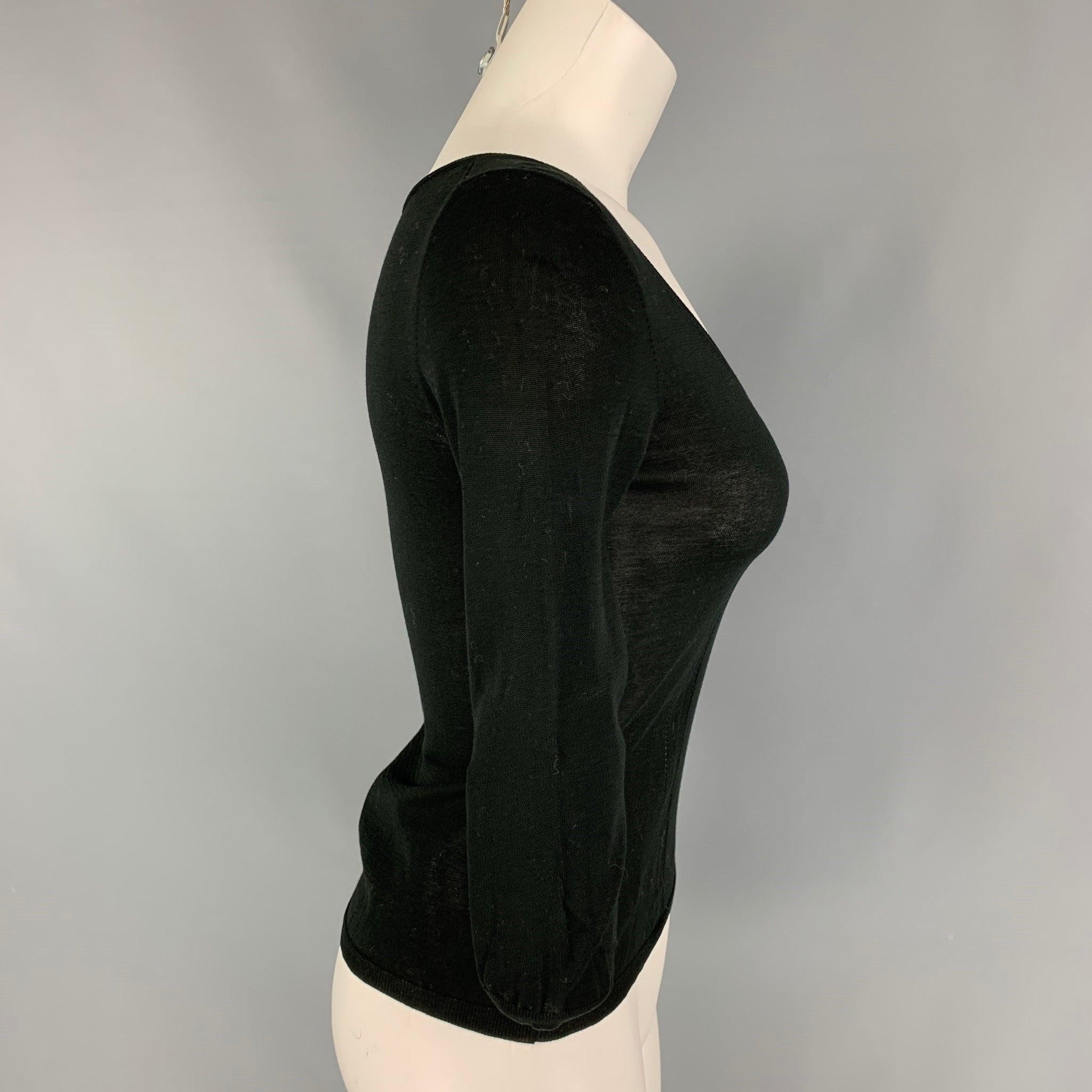 GUCCI pullover comes in a black cotton featuring a scoop neckline and 3/4 sleeves. Made in Italy.Very Good
Pre-Owned Condition. 

Marked:   XS 

Measurements: 
 
Shoulder: 13.5 inches  Bust: 28 inches  Sleeve: 17 inches  Length: 18.5 inches 
  
  
