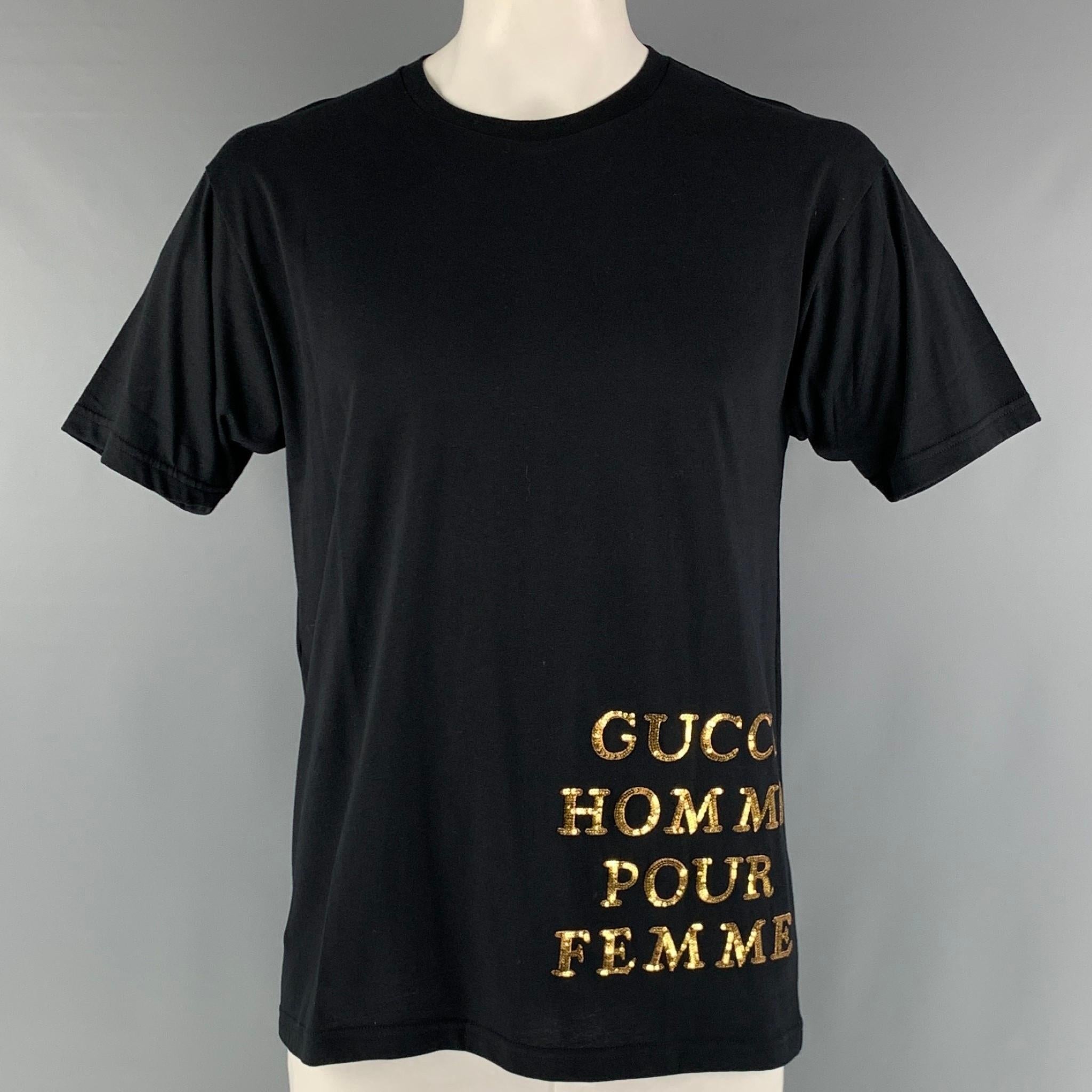 GUCCI oversized t-shirt comes in a black jersey cotton knit material featuring a gold tone embroidery phrase