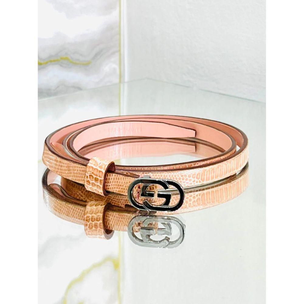 Gucci Skinny 'GG' Lizard Skin Belt

Apricot/Salmon coloured exotic skin belt with silver 'GG' logo buckle

Additional information:
Size: 68 cm - 73 cm
Composition: Lizard Skin 
Condition: Very Good/Excellent
Comes With: Belt Only 