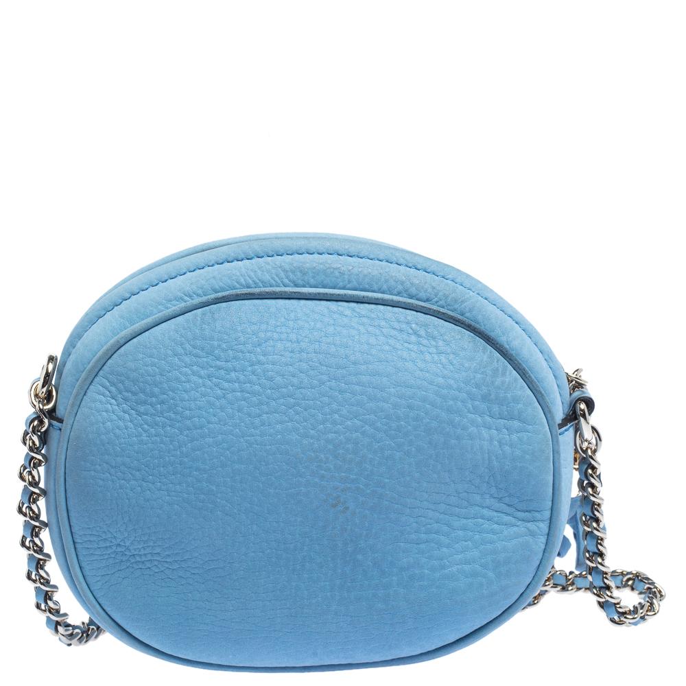 This Soho Disco bag is one of the many designs by Gucci that is loved by women worldwide. The bag is constructed from blue nubuck leather and designed with the signature GG on the front. It features a spacious canvas interior for your essentials, a