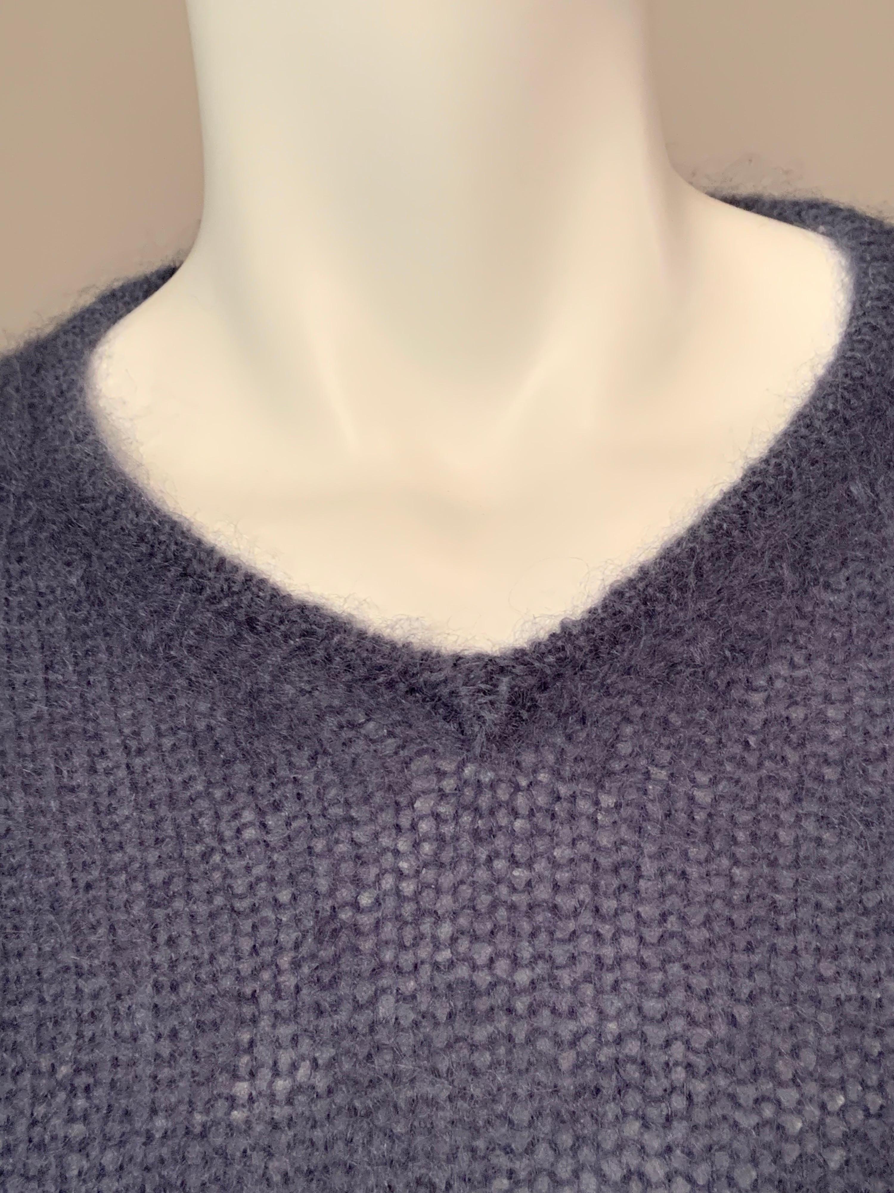 This Gucci slate blue mohair sweater is just the softest sweater!   It has a V shaped neckline and long sleeves that can be turned back for cuffs. It is marked a size Small and is in excellent condition.
Measurements;   Shoulders 16