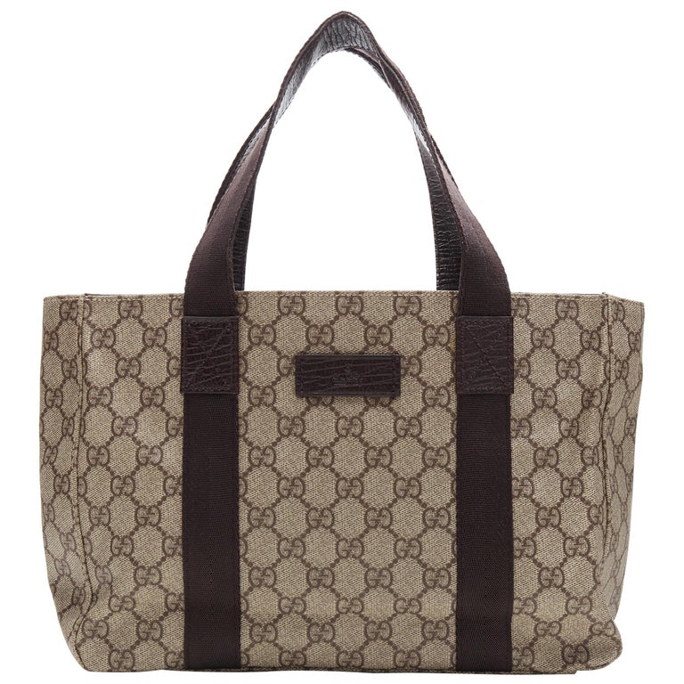GUCCI Small GG Plus brown coated canvas monogram leather nylon handle tote  bag at 1stDibs