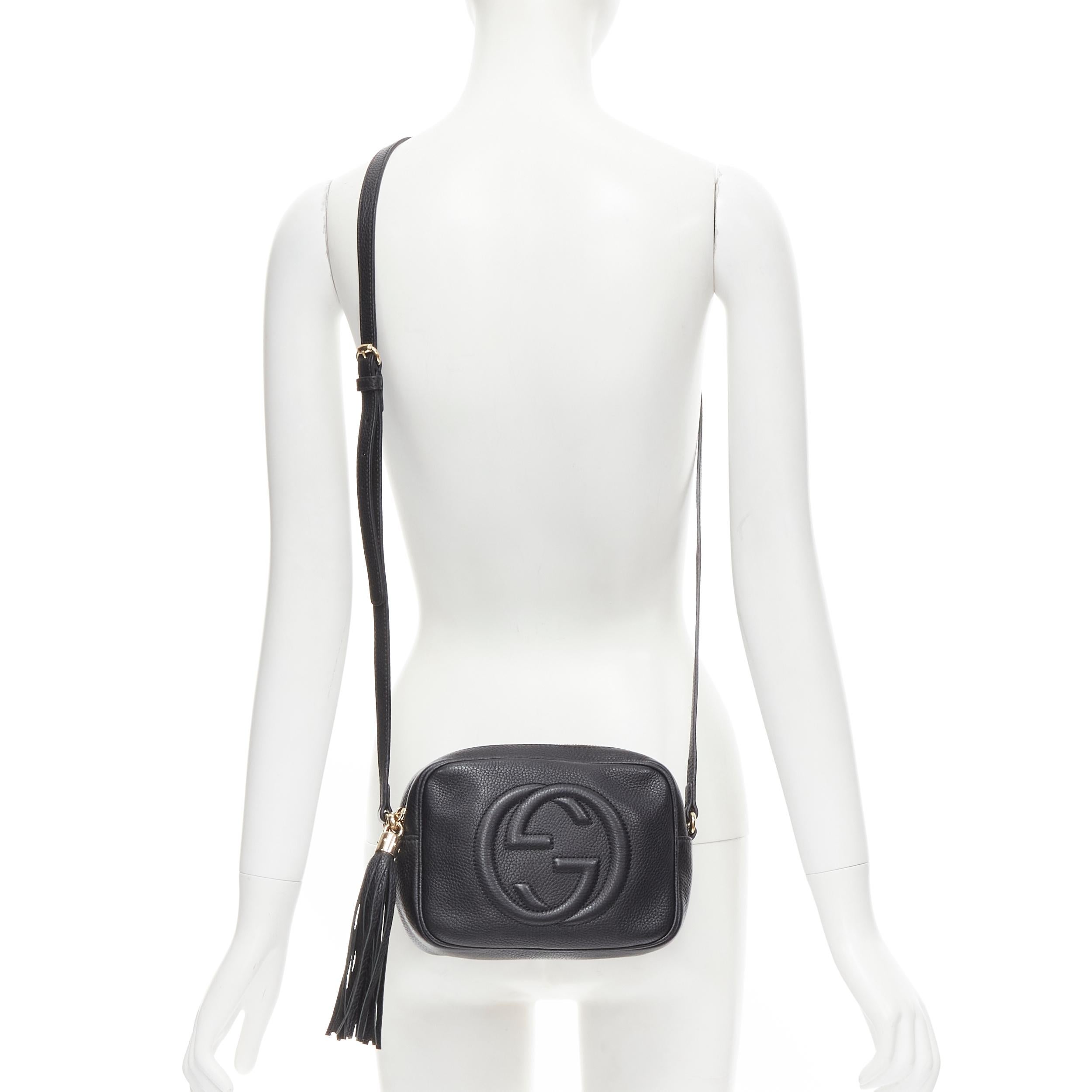 GUCCI Small Soho black grained leather logo tassel black crossbody Disco bag 
Reference: JECN/A00019 
Brand: Gucci 
Model: 308364 520981 
Material: Leather 
Color: Black 
Pattern: Solid 
Closure: Zip 
Extra Detail: Tassel zip closure. 2 wall pocket