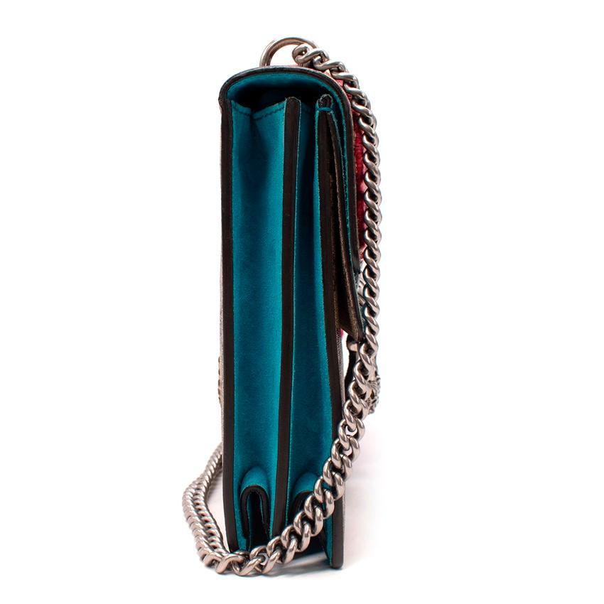 Gucci Snake Embellished Medium Dionysus Chain Strap Bag
 

 - Medium Dionysus in GG monogram canvas contrasted with a vivid turquoise suede, and raised emboridery snake, hibiscus and bee motifs
 - Flap front with magnet closure and aged silver-tone
