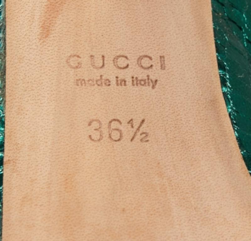 It's time for some bold and chic steps with these Gucci sandals. Created from snakeskin-embossed leather, the design is equipped with an ankle buckle closure, platforms, and 13cm heels.