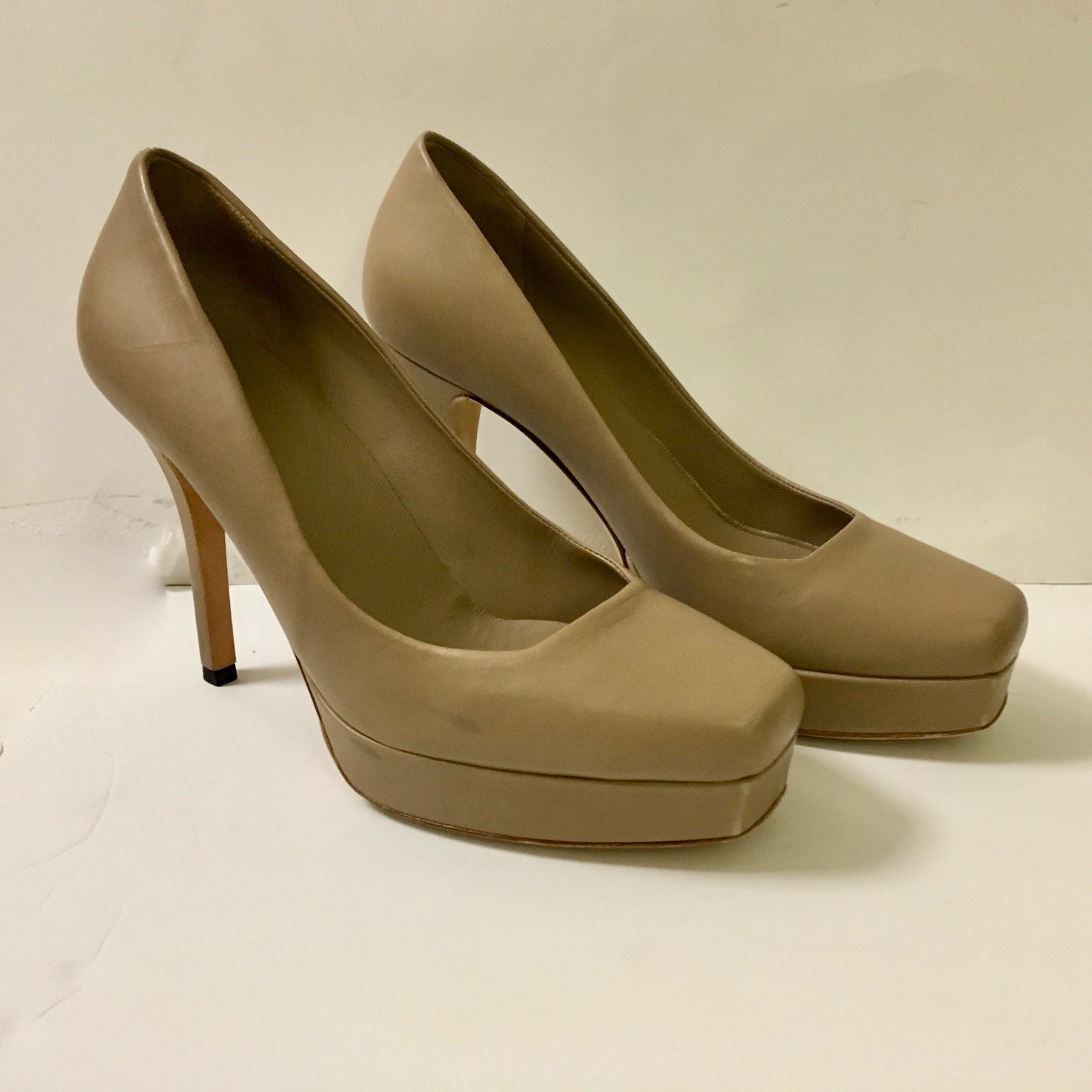 Brand new Gucci soft leather platform shoes in beige. The style is Charlotte. They are a size 37, but Gucci tends to run a little on the big size, so it probably would best fit a size 37.5. The size of the heel is 4 inches. There is a 1 inch