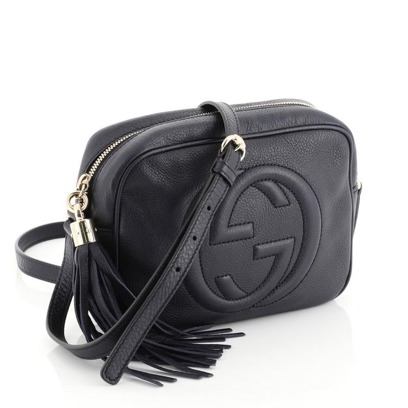 This Gucci Soho Disco Crossbody Bag Leather Small, crafted in blue leather, features an adjustable leather strap, tassel zip pull, and gold-tone hardware. Its zip closure opens to a neutral fabric interior with slip pockets. 

Estimated Retail