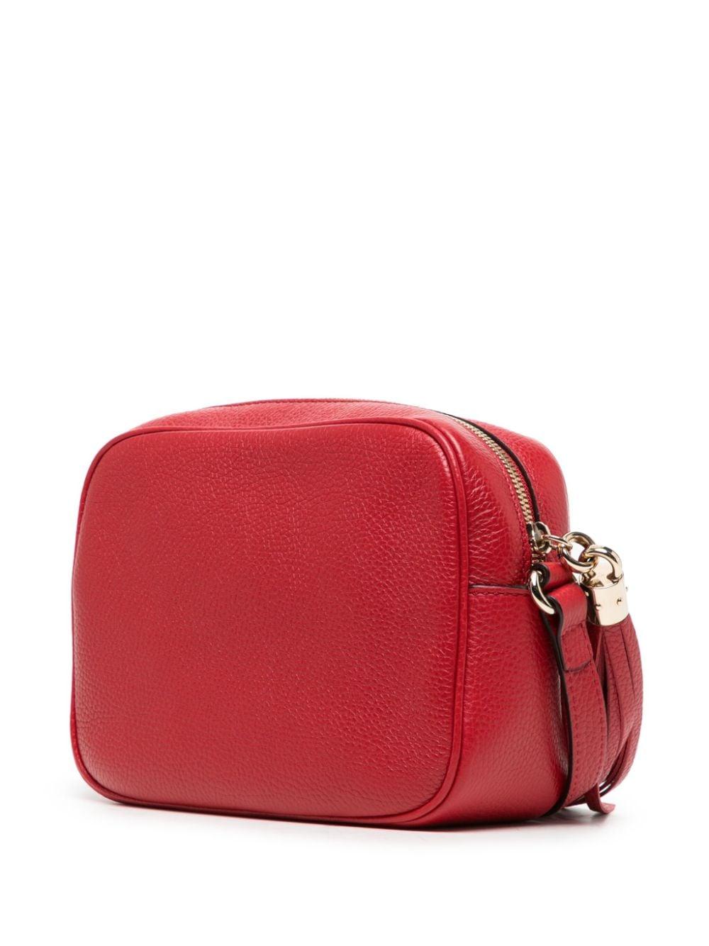 The Gucci Soho Disco Shoulder Bag, first introduced in 2012, is a timeless classic that blends luxury and functionality. Meticulously crafted from pebbled leather, it showcases the iconic interlocking G logo embossed on the front. Lightweight and