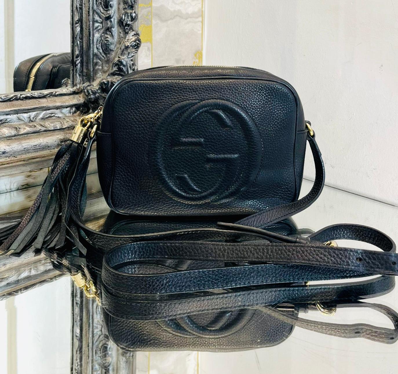 Gucci Soho Leather Camera Bag

Black crossbody bag designed with 'GG' logo embossed to the front.

Featuring gold hardware and tassel detailed top zip closure leading to two interior open pockets.

Size – Height 15cm, Width 20cm, Depth