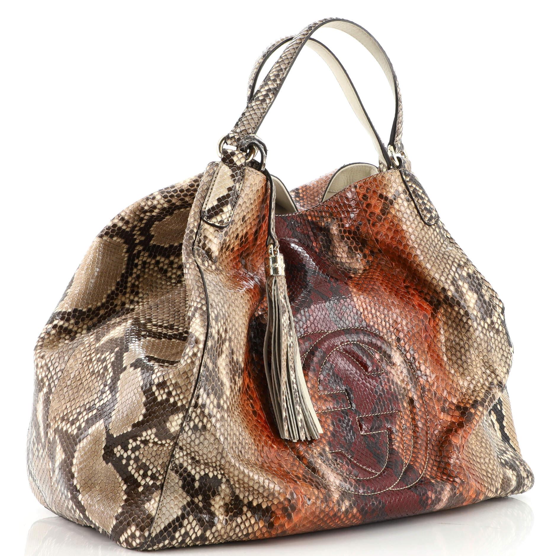 This item can only be shipped within the United States.

Estimated Retail Price: $4,000
Condition: Very good. Creasing and lifting of scales on exterior and handles, light wear in exterior, scratches on hardware.
Accessories: Tassel
Measurements: