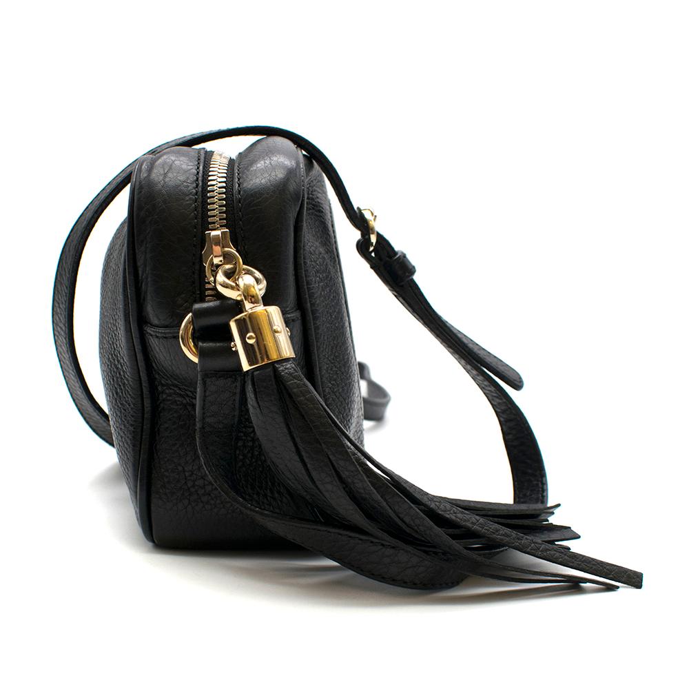 A compact shoulder bag with a leather tassel zipper pull. Sized to fit the necessities. Made in Gucci's light, natural grain leather.

Black leather
Light gold-toned hardware
Leather tassel
Embossed Interlocking G
Interior phone and open