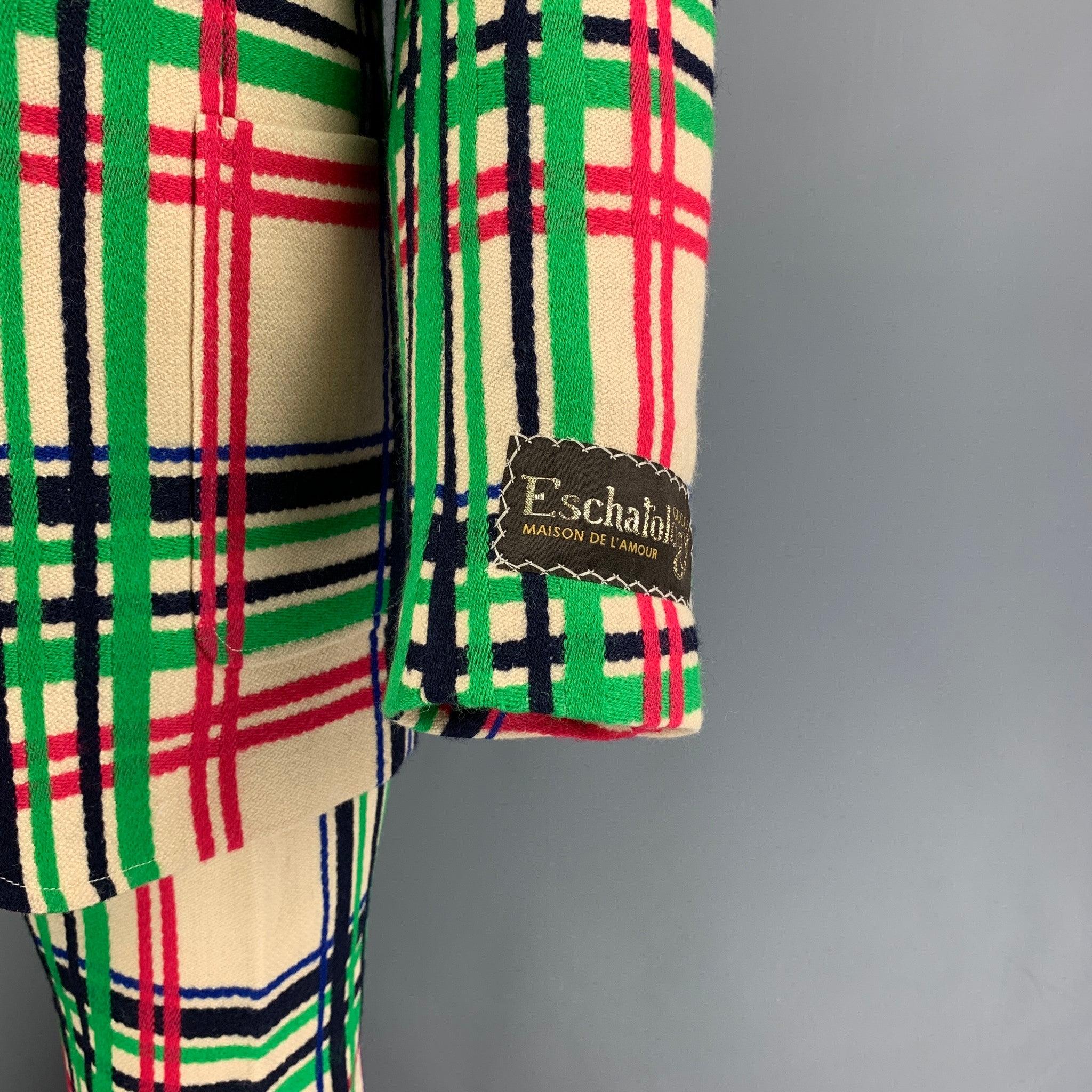 GUCCI Spring Summer 2021 suit comes in multi-color plaid wool / cotton with a full liner and includes a single breasted, double button sport coat with lapel and matching flat front trousers. Made in Italy. New With Tags.  

Marked:   46