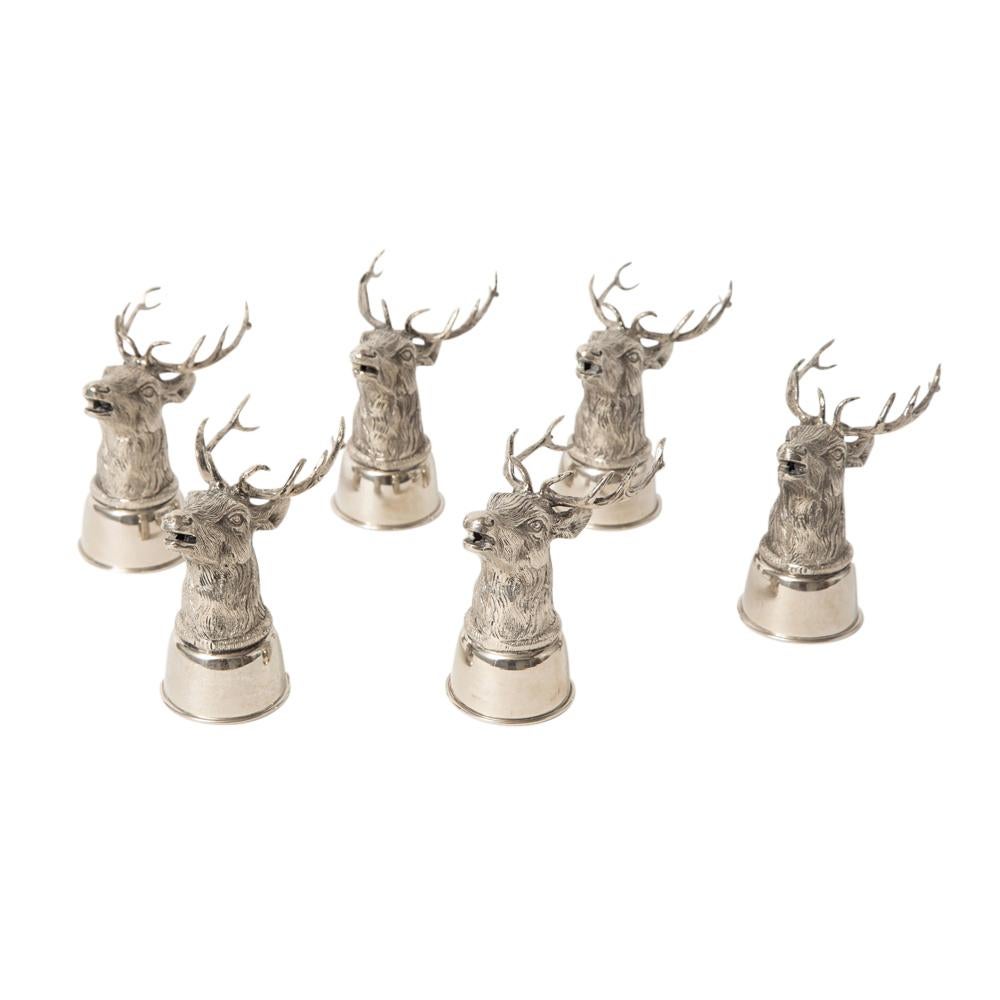 Gucci stag stirrup cups, silver plated brass, signed. Set of six stirrup cups which can be displayed on their bases and upside down on their antlers. Beautifully detailed with textured top, banded center and semi-gloss bottom. Signed: 