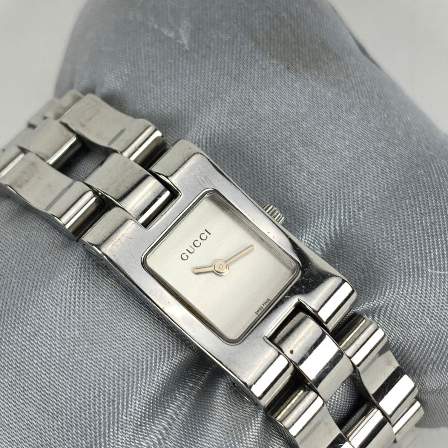 Gucci 2305 L stainless steel wrist watch. Stainless steel case (Approximately 28 mm x 17 mm). White Dial and Sapphire crystal. Swiss Made Quartz movement. Gucci written on face, clasp & reverse.Water Resistant to 3atm. Deployant Clasp. Swiss Made.