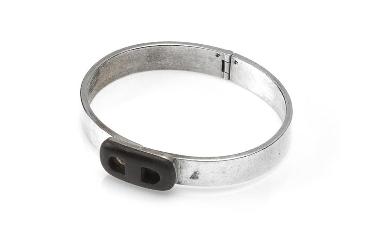 A classic bracelet by Gucci, crafted out of sterling silver with an ebony wood clasp.

Marked on interior of bracelet,

circa 1960s.
