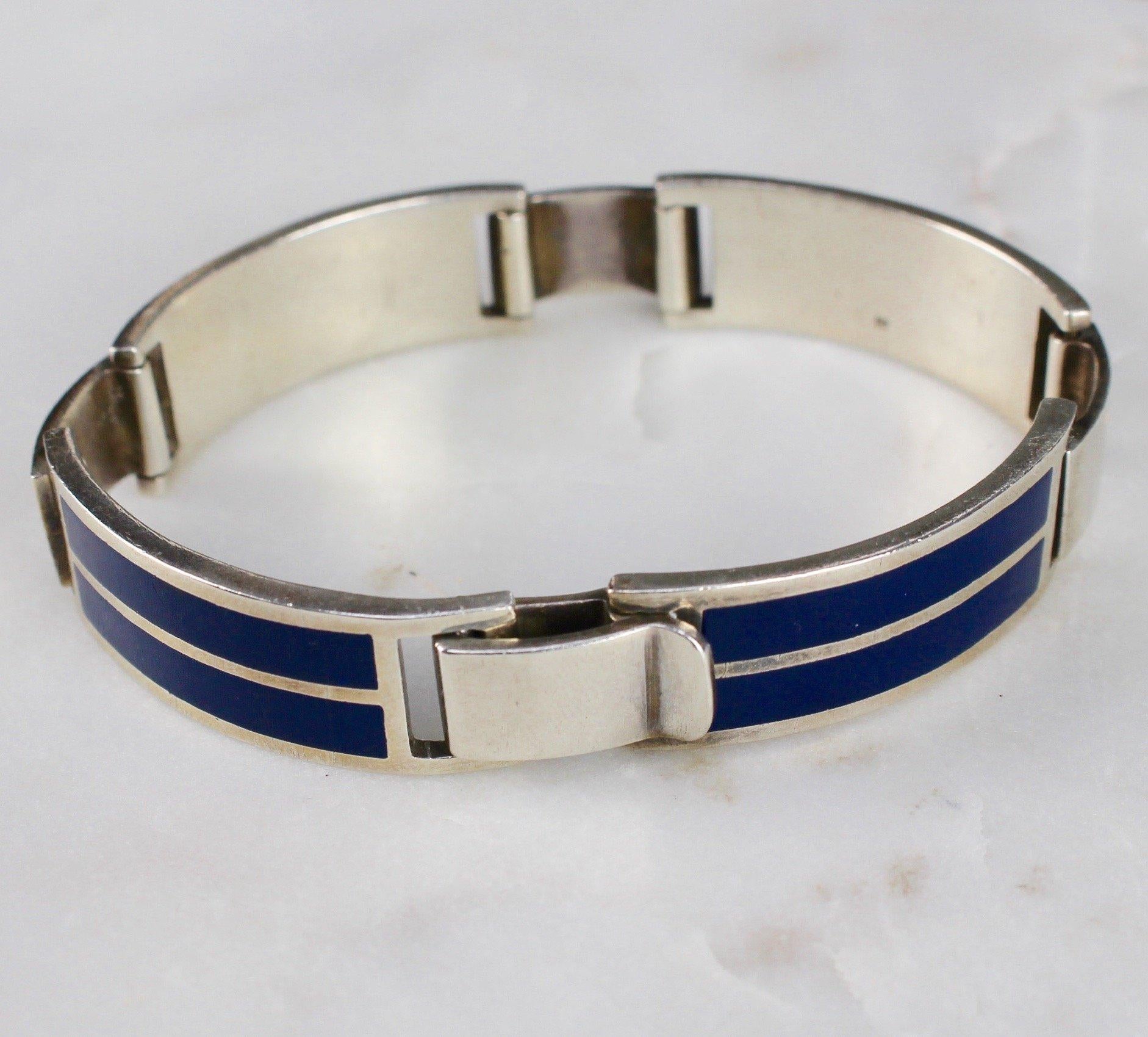 Iconic Gucci sterling silver and enamel bracelet. Mark 'A' indicates 1975. Leopard head mark represents origins of London, England. Sterling silver -lion mark - with blue enamel. Rare vintage piece - very collectable. In very good vintage