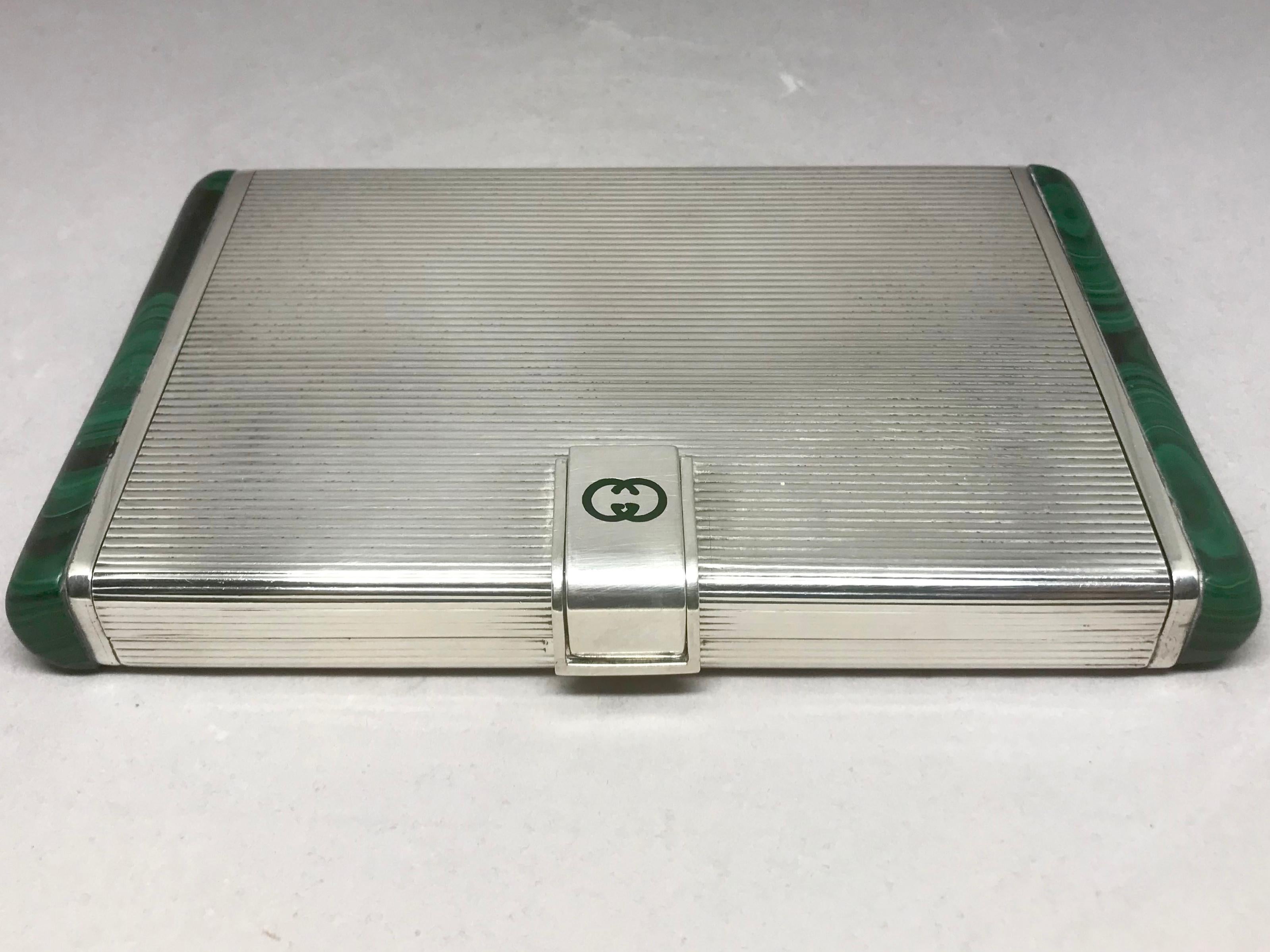 Gucci sterling silver and malachite box. Large fine ribbed sterling cigarette case / minaudiere with malachite ends and clasp with inset malachite early vintage GG logo. Stamped with silver hallmarks and early cursive Gucci logo. Italy,