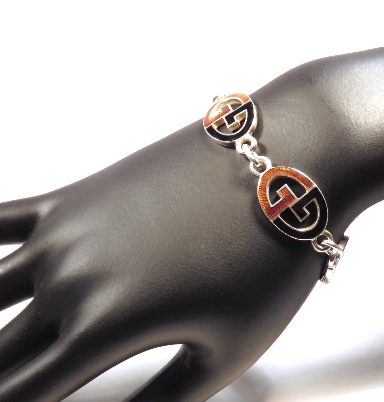 Rare iconic vintage Gucci's bracelet handcrafted in Italy in sterling silver with black and brown enamel.The total length of the bracelet is 170 mm / 6.692 inches. Marked with the Italian sterling silver mark 925 and the brandmark Gucci