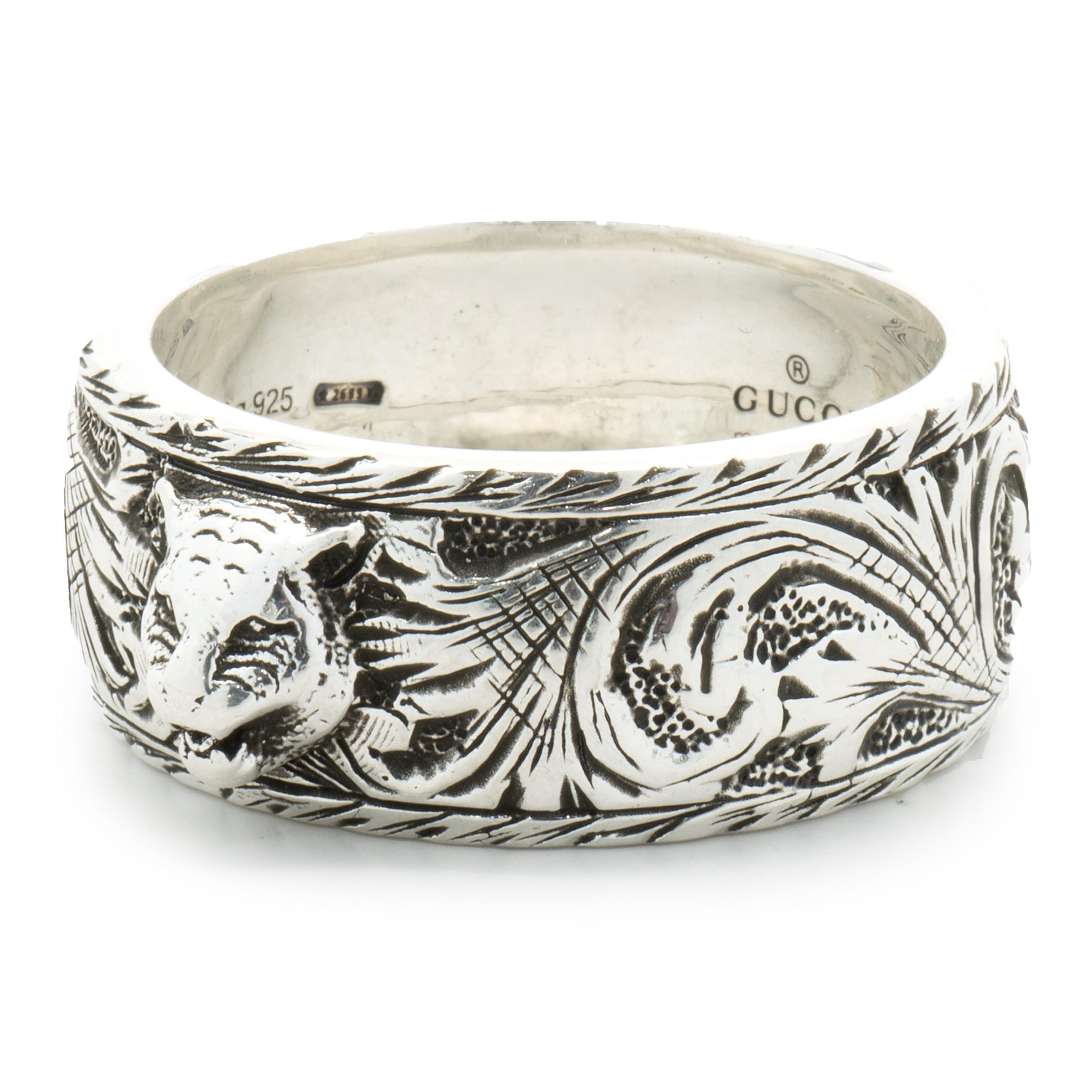 Designer: Gucci
Material: sterling silver
Dimensions: band measures 10mm wide
Weight: 11.58 grams
Size: 10
