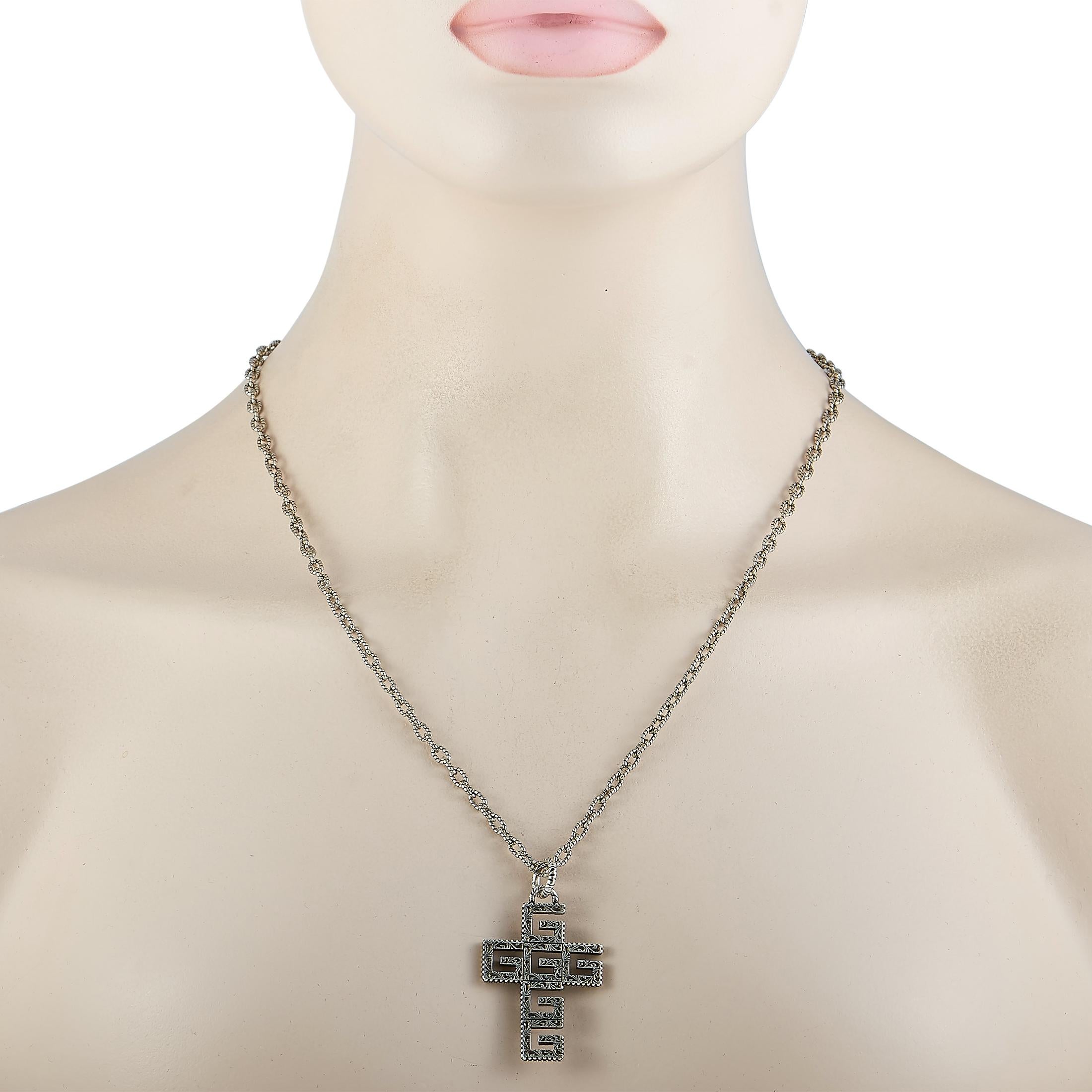 This Gucci necklace is crafted from sterling silver and weighs 28.9 grams. The necklace is presented with a 27” chain and boasts a G-Cube cross pendant that measures 1.75” in length and 1.12” in width.

Offered in brand new condition, this jewelry