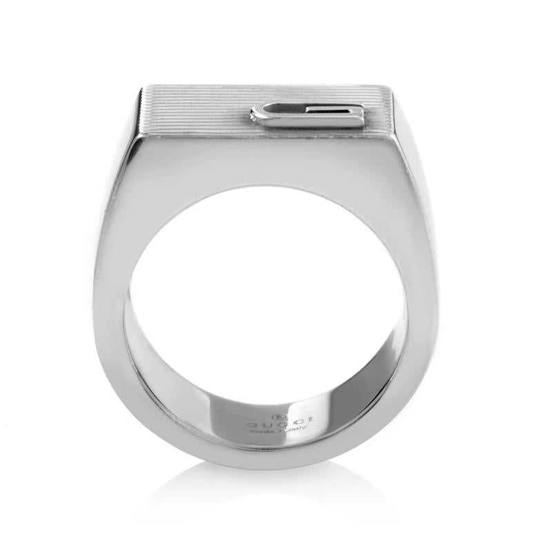 This exceptionally stylish signet ring from Gucci is a classic ring in every sense of the word. It is elegantly crafted in attractive sterling silver with the band forming an oblong ridged platform as the chic setting and a trademark Gucci initial