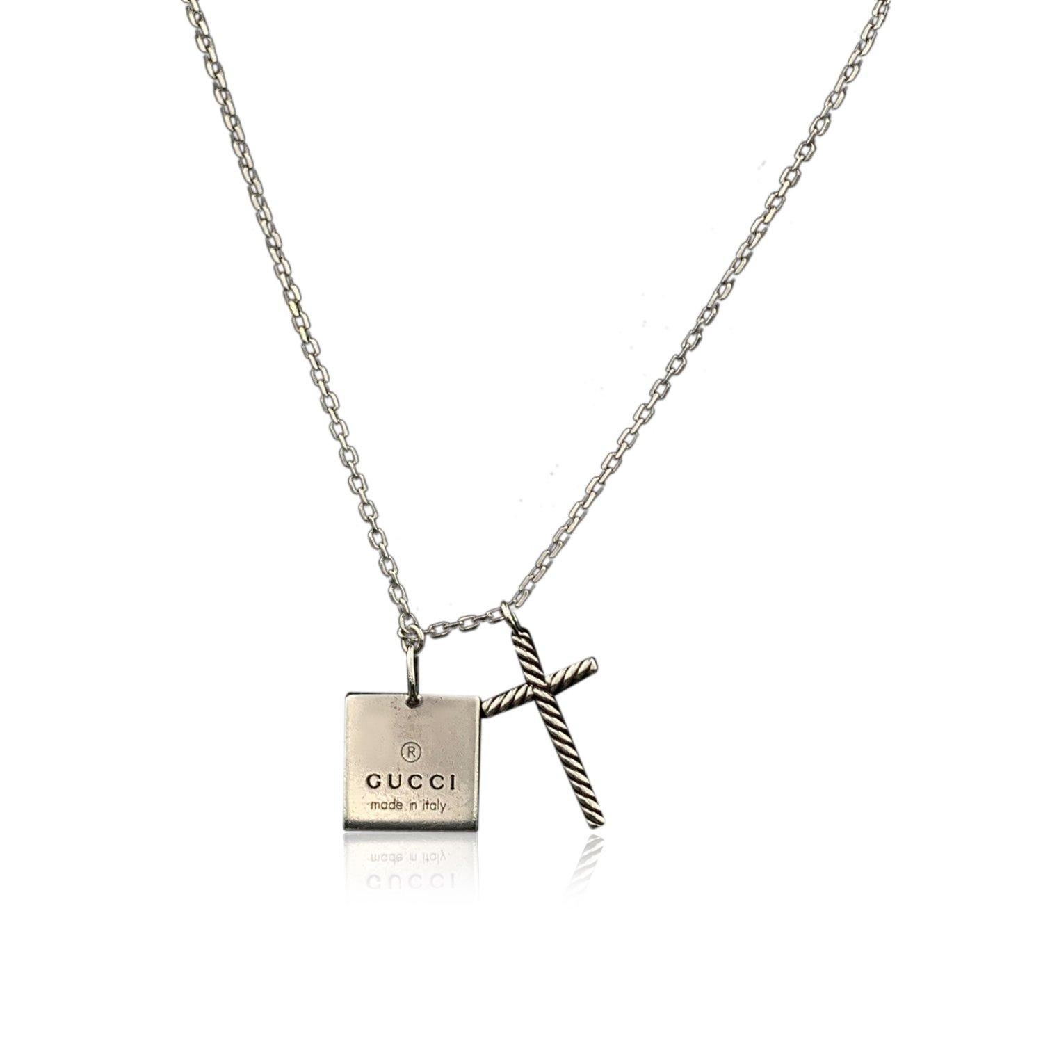 Classic unisex chain necklace by Gucci. Made in sterling silver. Square logo pendant and cross pendant. Lobster closure. Total length of the chain: 18.5 inches - 45.7 cm .'Gucci - made in Italy' engraved on the pendant. 'Ag925' hallmark engraved on