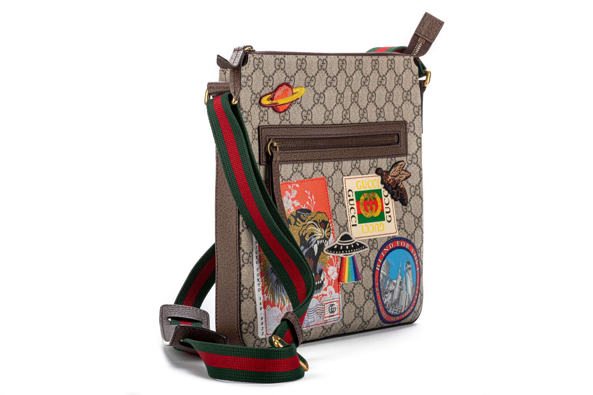 Gucci travel stickers crossbody bag with coated canvas gg logo pattern. Limited edition. Comes with tags and original dust cover.