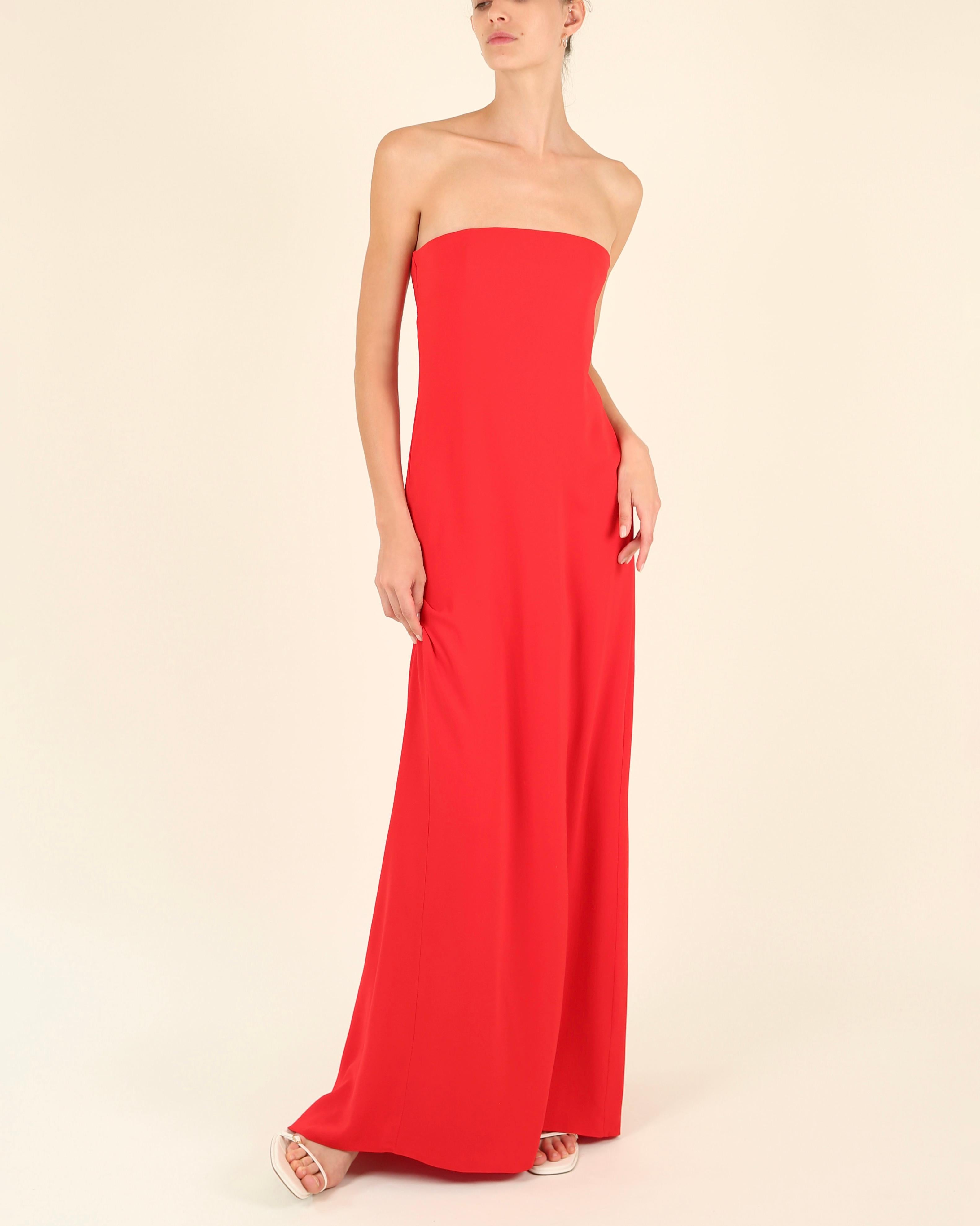 LOVE LALI Vintage

A beautifully simple and elegant yet striking dress by Gucci in vibrant red
Strapless cut that falls as a column gown
Beautiful long ties wrap at the back and tie into a bow creating long folds of flowing fabric that create a