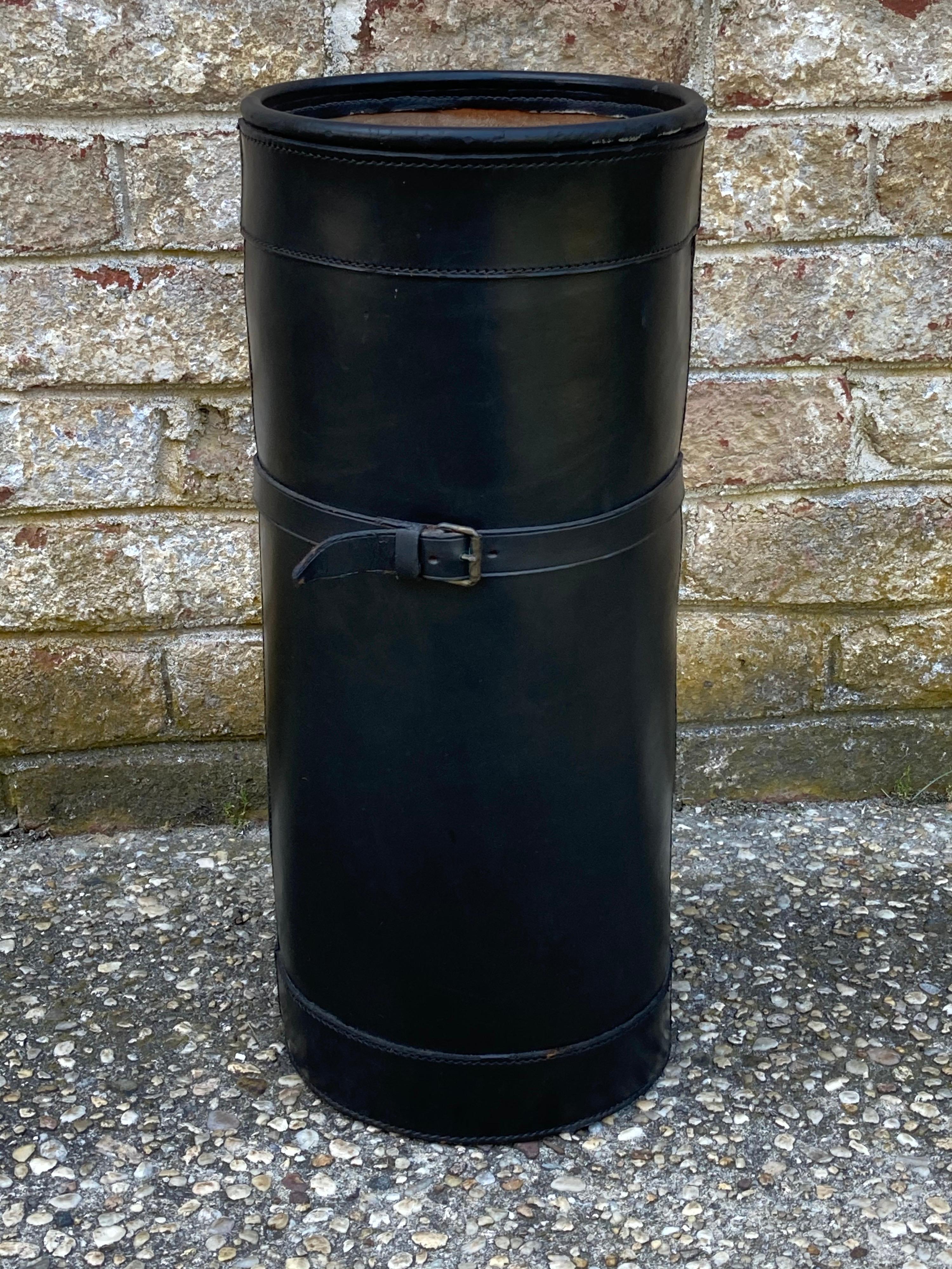 Handsome black leather umbrella stand with brass horse bit with in the style of Gucci.