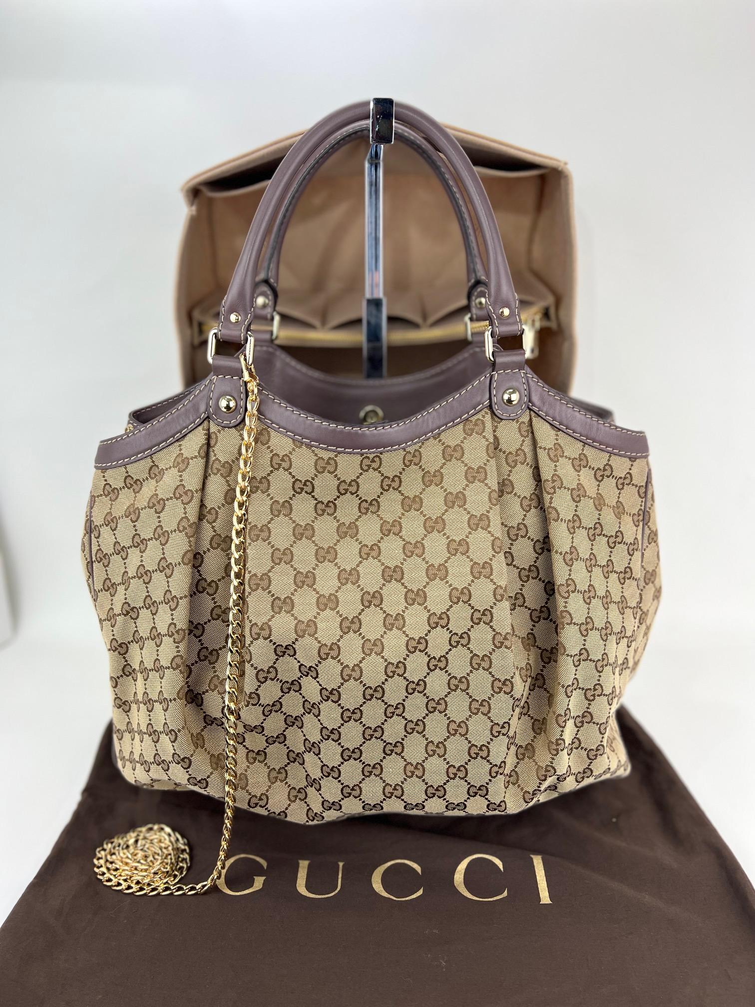 Pre-Owned 100% Authentic
Gucci Large Sukey GG Monogram Canvas Tote
W/Added Insert to help Organize and Keep Bag Upright
and Non Gucci Chain
RATING: B   very good, well maintained,
shows minor signs of wear
MATERIAL: GG monogram canvas and leather