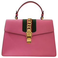 Gucci Sylvie Tasche mit rosa Henkel