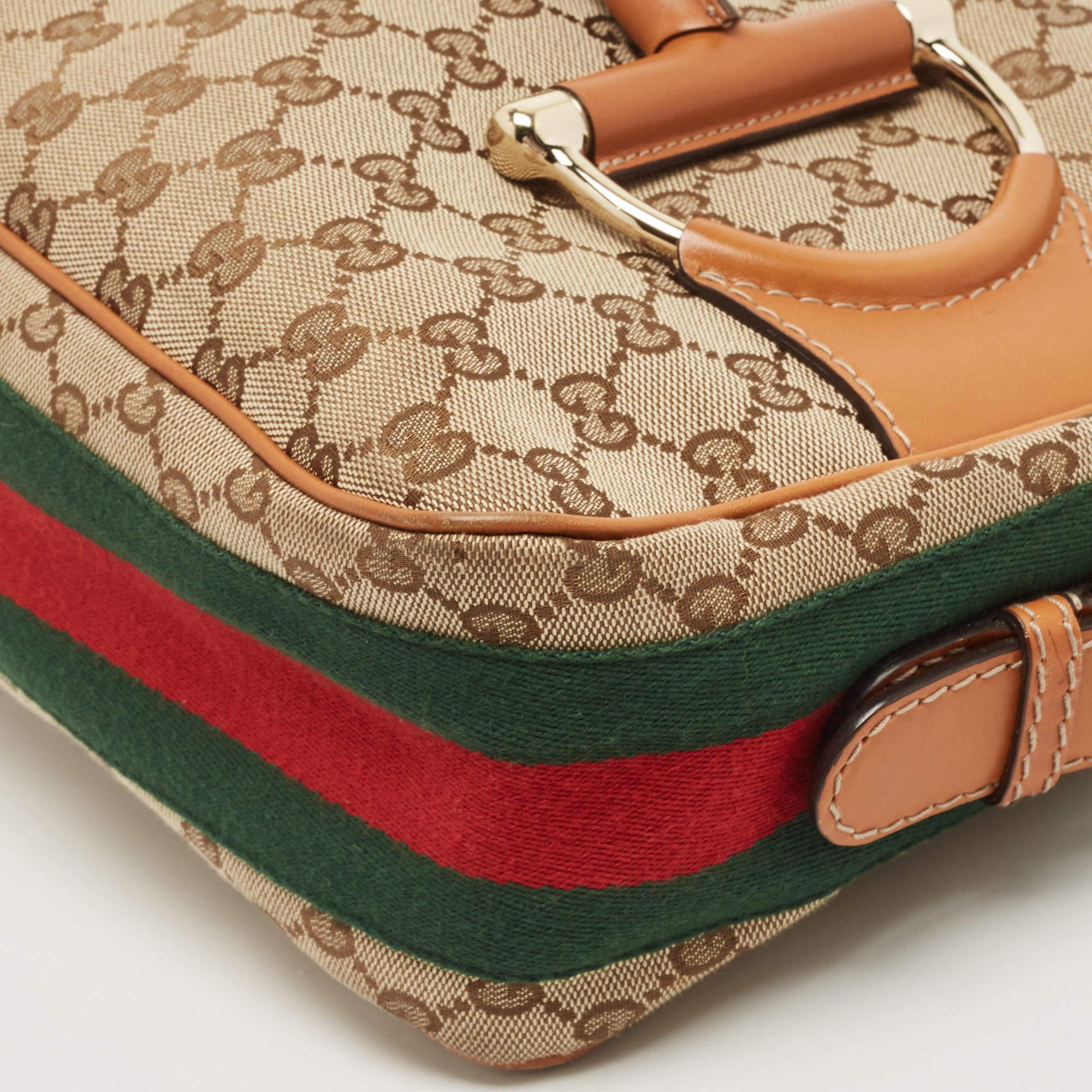Brimming with signature details of the brand, this Heritage hobo from Gucci continues to remain in prominence. It is created with the brown-beige GG canvas and leather on the exterior with a Web strap detailing. The Horsebit motif decorates the