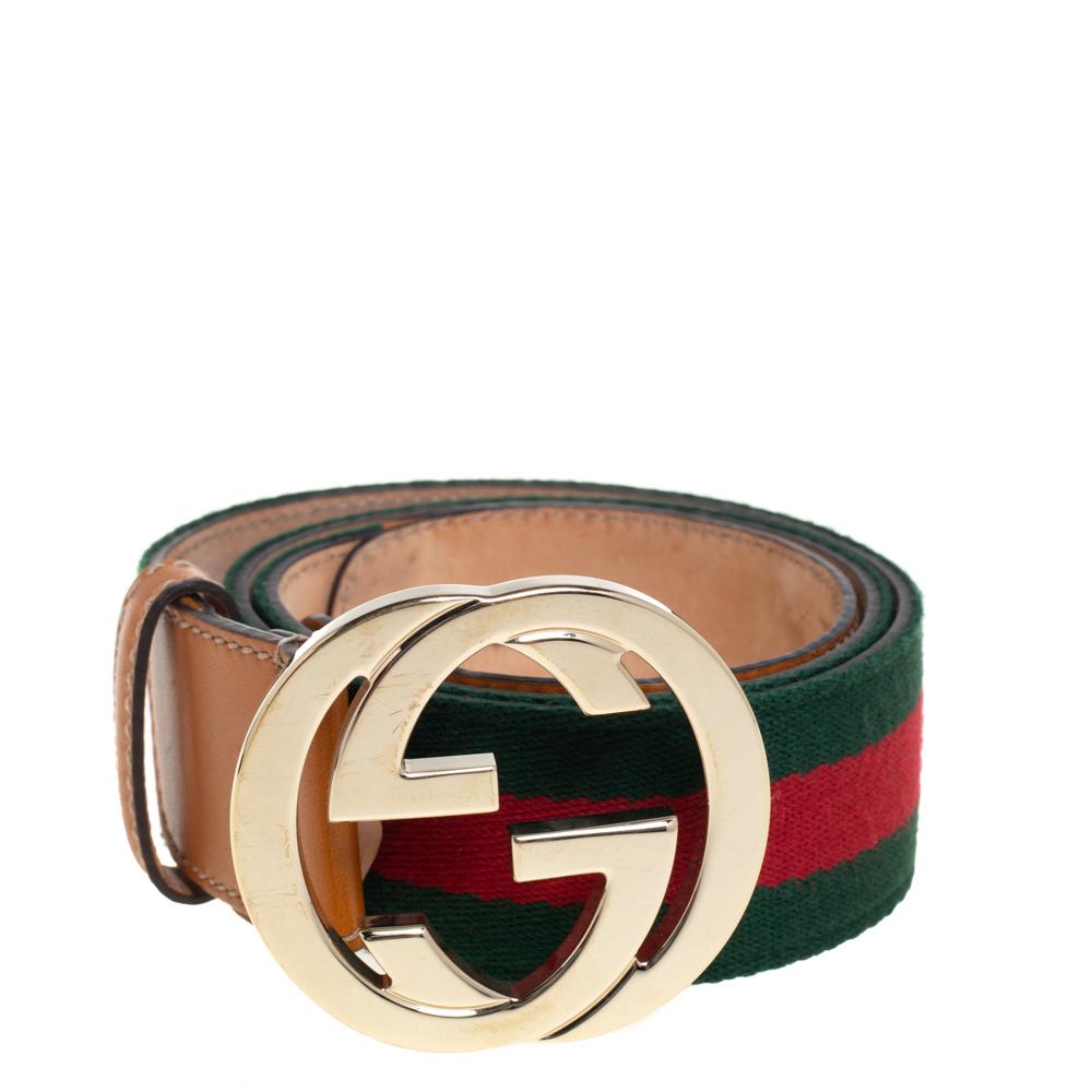 The interlocking G belt by Gucci is made in Italy using Web canvas and tan leather keeping casual styling in mind. It is finished with the House's GG buckle in gold-tone hardware.

