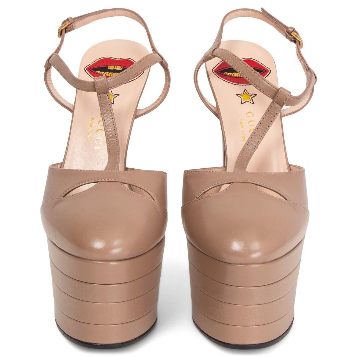 100% authentic Gucci Angel T-Strap Plattform Sandals in tan calfskin with ankle-strap closure. Brand new. 

Measurements
Imprinted Size 38
Shoe Size 38
Inside Sole 24.5cm (9.6in)
Width 7.5cm (2.9in)
Heel 16cm (6.2in)
Platform: 5.5cm (2.1in)

All our