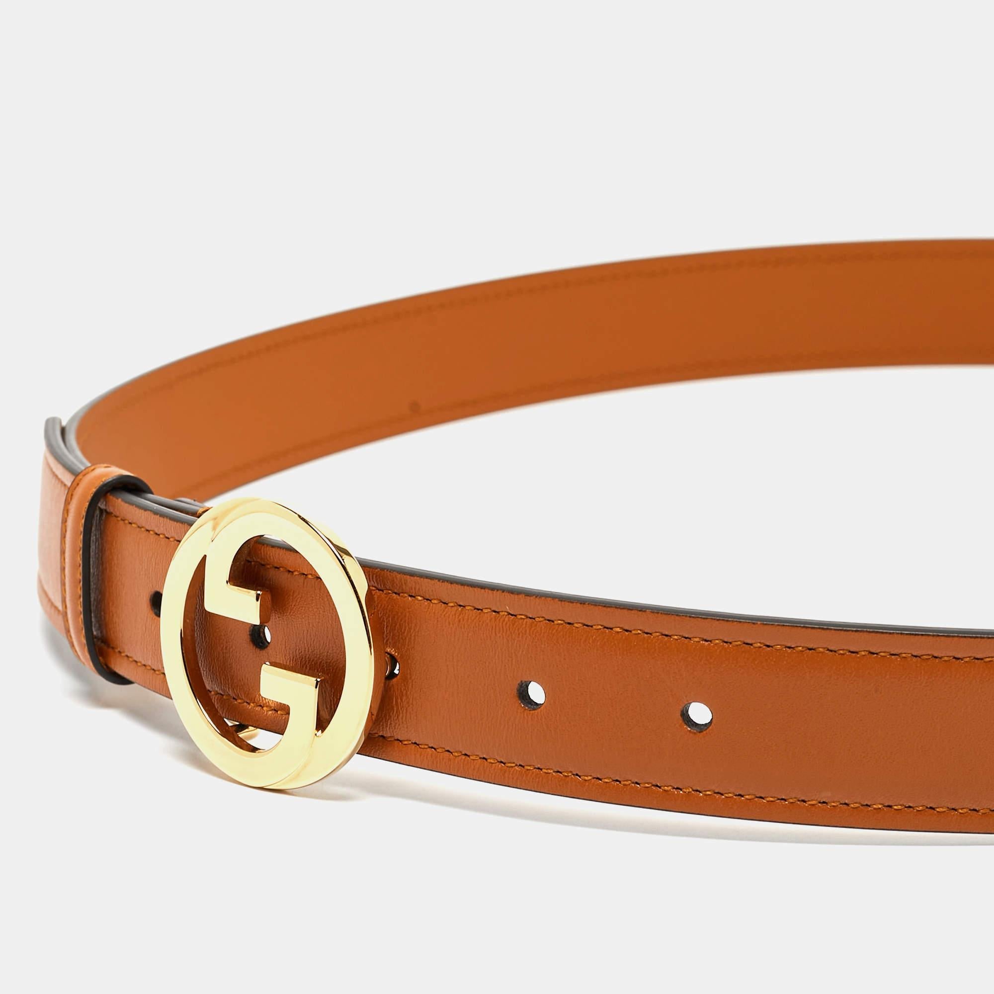 This Gucci belt is crafted from leather. The classic piece has tan shade to match a variety of outfits. It is completed with a gold-tone interlocking G buckle.

