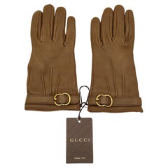 Guanti Gucci in pelle marrone con fibbia logo in metallo dorato