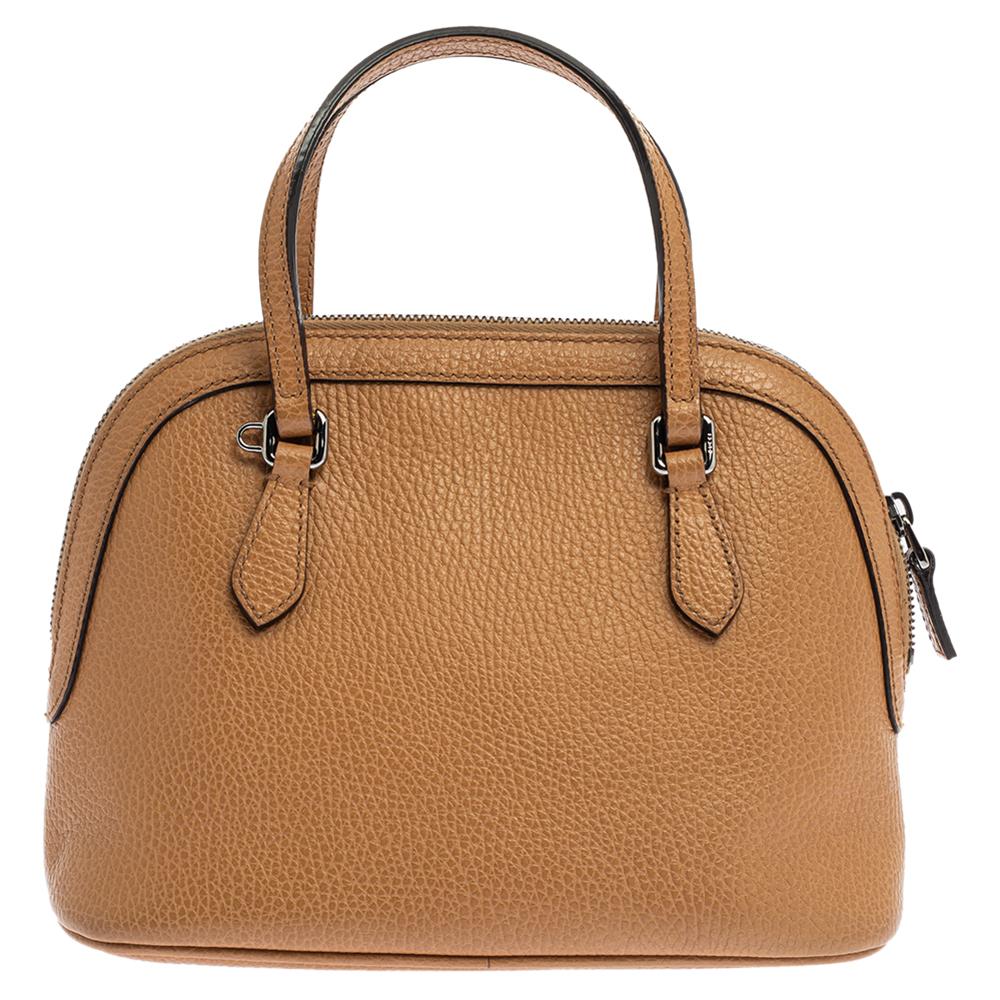 Celebrated for its skillful designs, this bag from Gucci is just what you need. Choose the right color keeping in mind fashion trends. This tan bag is sure to be the showstopper. Get ready to grab a lot of attention for your lavish and awesome