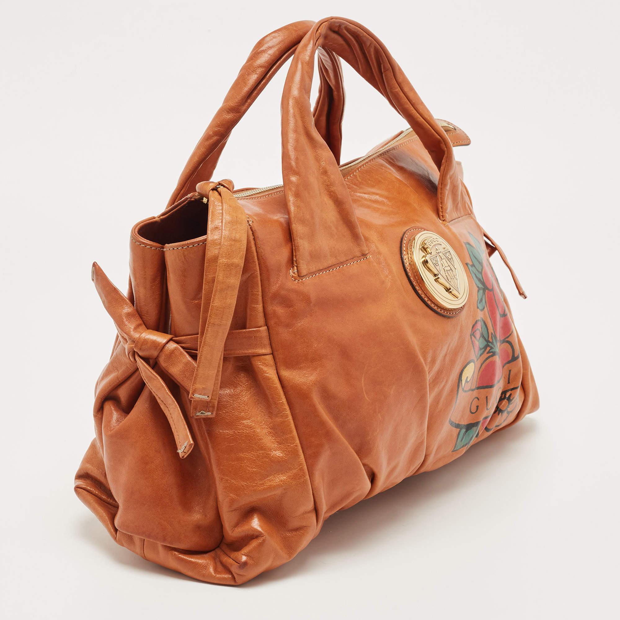 Introduced in 2008, the Gucci Hysteria is loved and admired by style enthusiasts all around the world. The fabric and leather interior of this hobo is spaciously sized to keep your daily belongings safe. Created from tan leather with beautiful