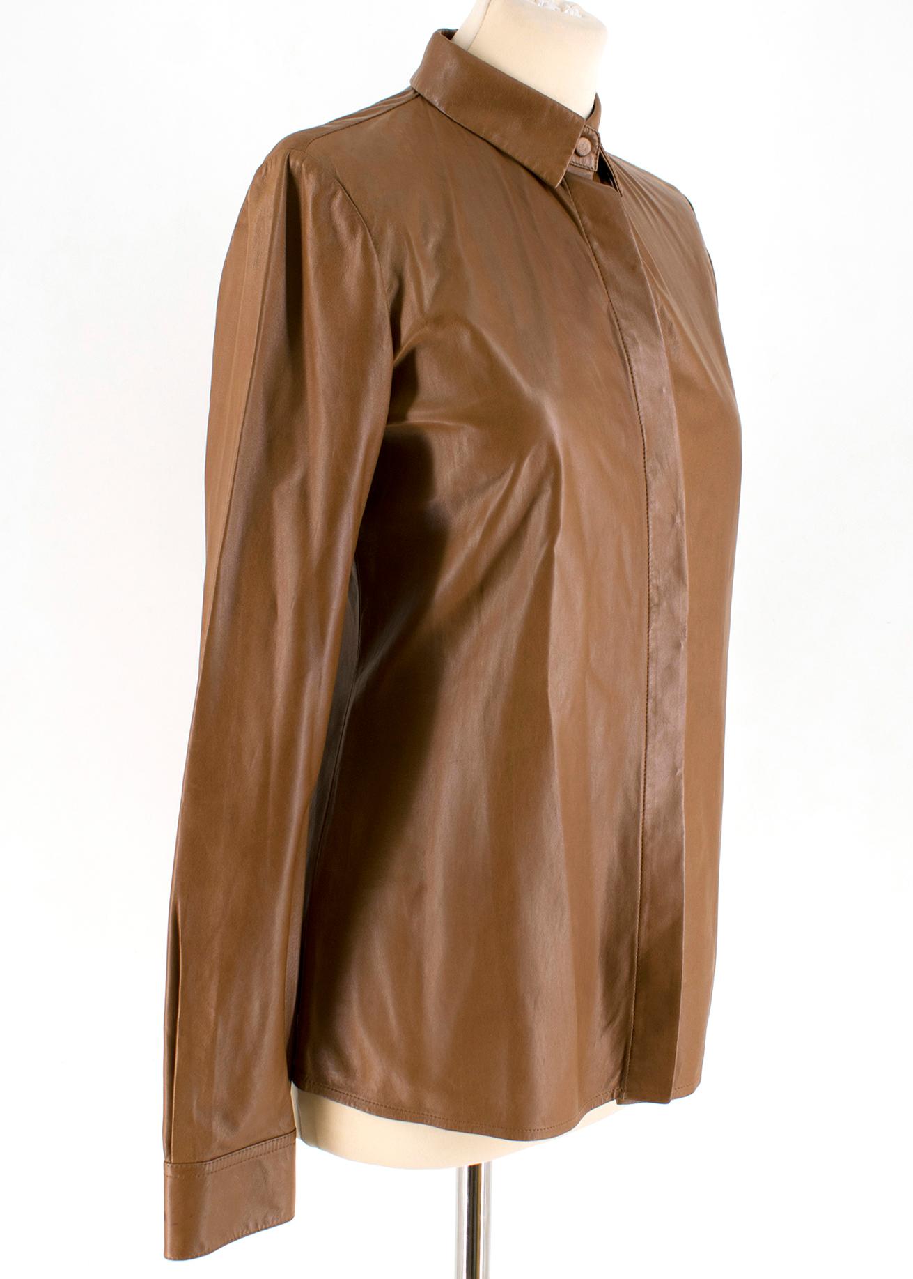 Gucci Leather Shirt 

Soft, fine leather 
Nut brown button down 
Point collar 
Button fixtures hidden when buttoned up
Buttoned cuffs 
Supple and lightweight

Please note, these items are pre-owned and may show some signs of storage, even when