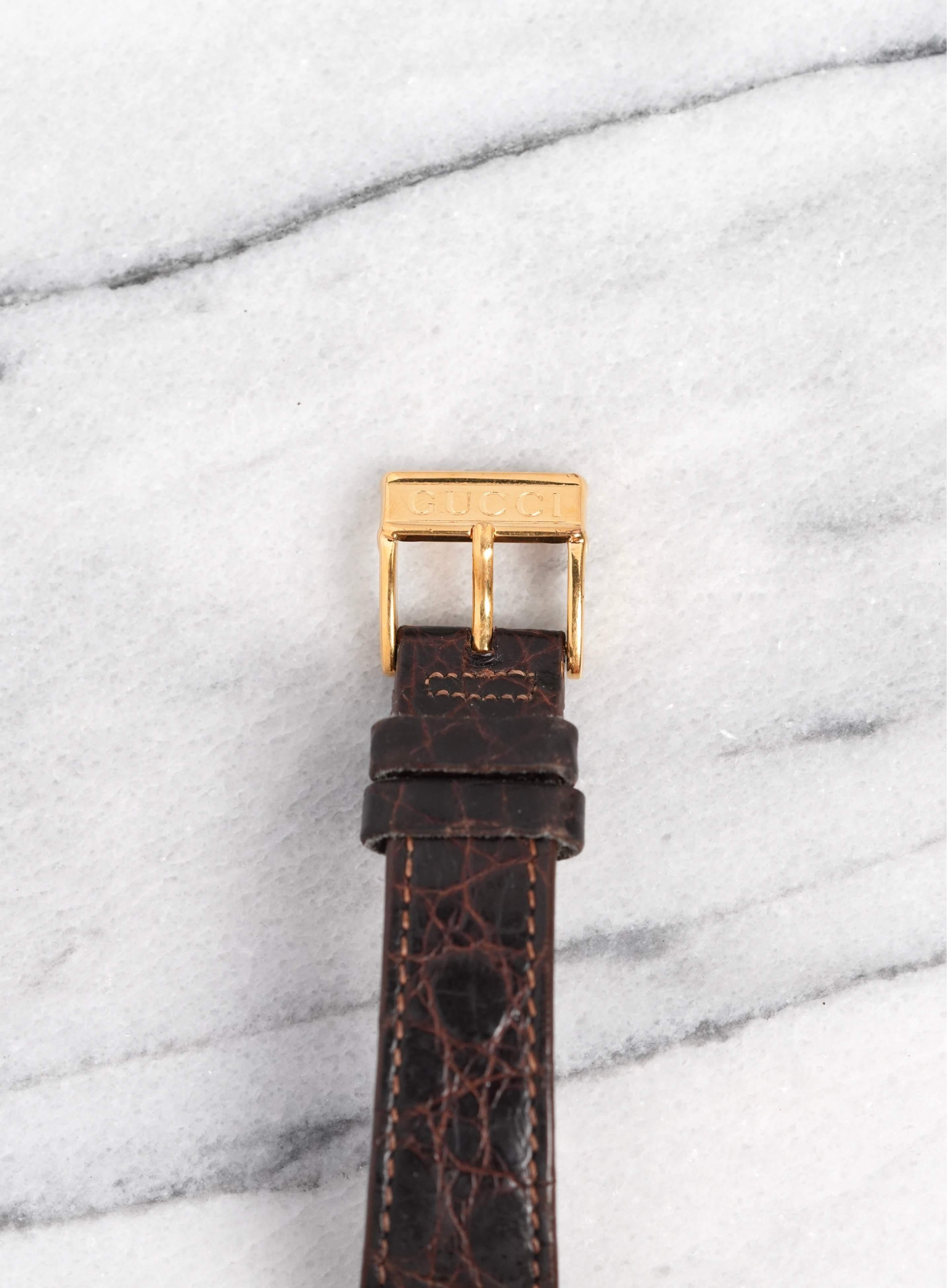 Here's a vintage Gucci Tank quartz in 18K yellow gold with a white lacquer Roman numeral dial from the late 70s, early 80s. Keeps great time and is fully functional. Measurements include a 23x30mm case size and 18mm lug width. It’s on its original