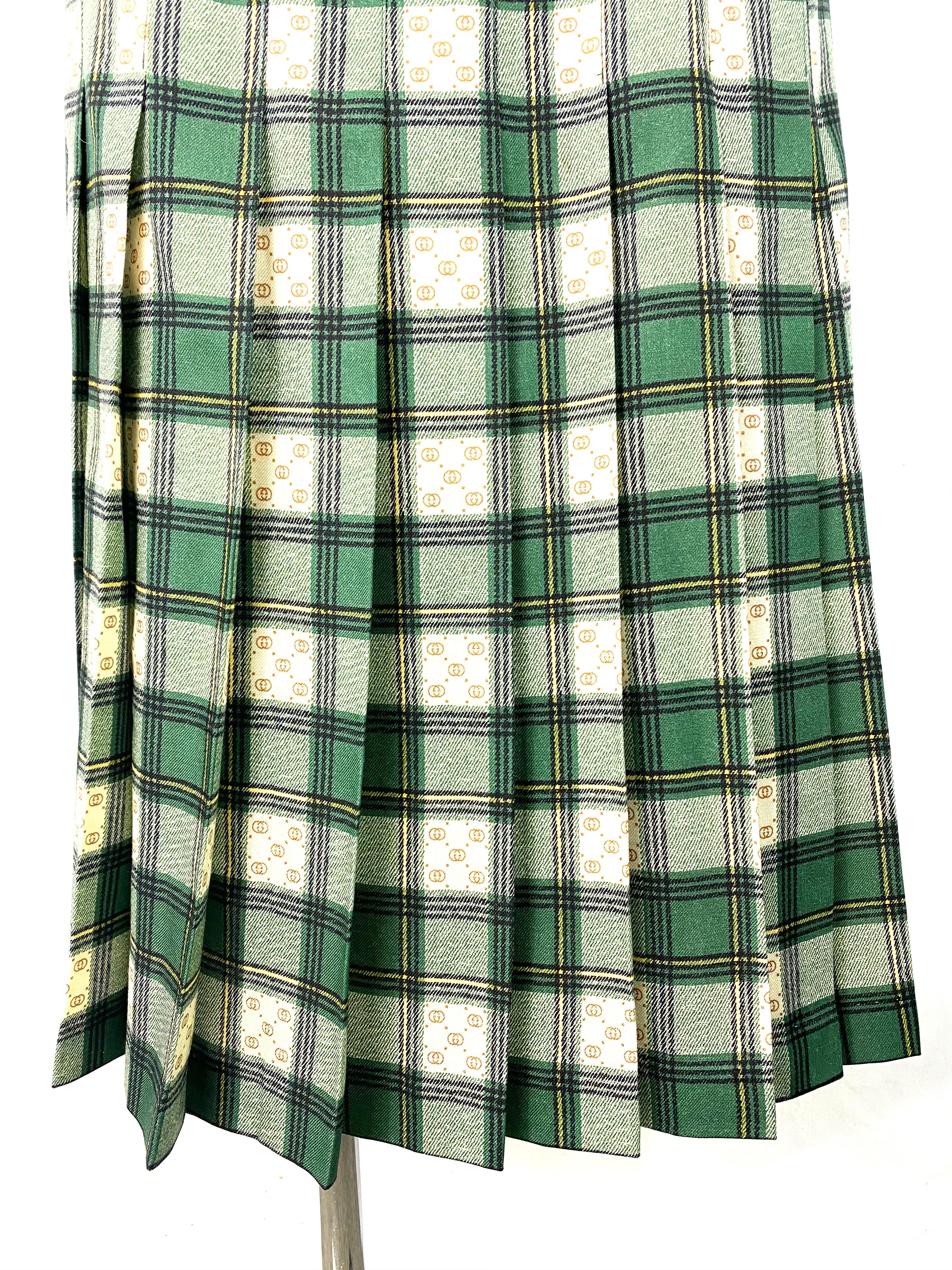 Product details:

Featuring the wool skirt with the GG motif woven between the green and beige tartan pattern. Relaxed fit with  high-rise waist and secured with two buckle-fastening tabs. Made in Italy.